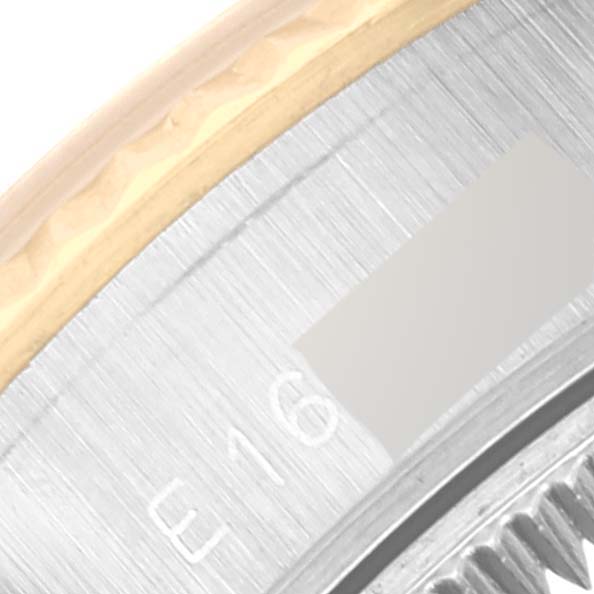 This close-up image shows the side bezel and part of the back casing of a Rolex Datejust 69173 Women's Steel and Gold (two tone) Champagne Dial 69173 Women's Steel and Gold (two tone) Champagne Dial watch.