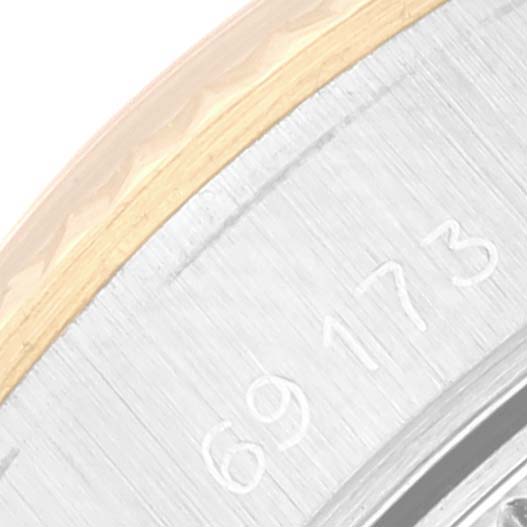 This image shows a close-up view of the serial number on the case back of a Rolex Datejust 69173 Women's Steel and Gold (two tone) Champagne Dial 69173 Women's Steel and Gold (two tone) Champagne Dial watch.