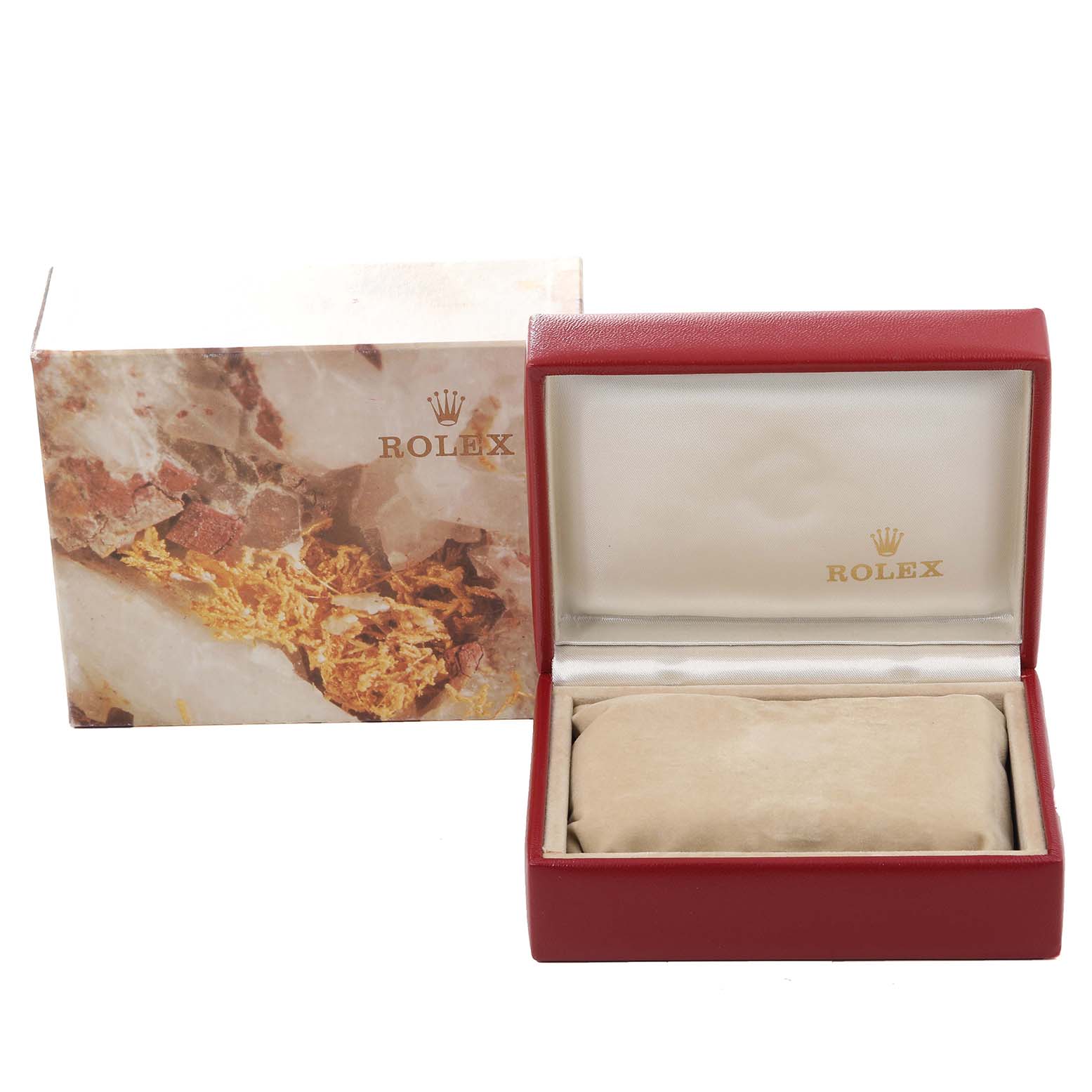 This image shows a Rolex Datejust 69173 Women's Steel and Gold (two tone) Champagne Dial 69173 Women's Steel and Gold (two tone) Champagne Dial watch's marbled gift box and an open red leather cushioned case, without the watch present.