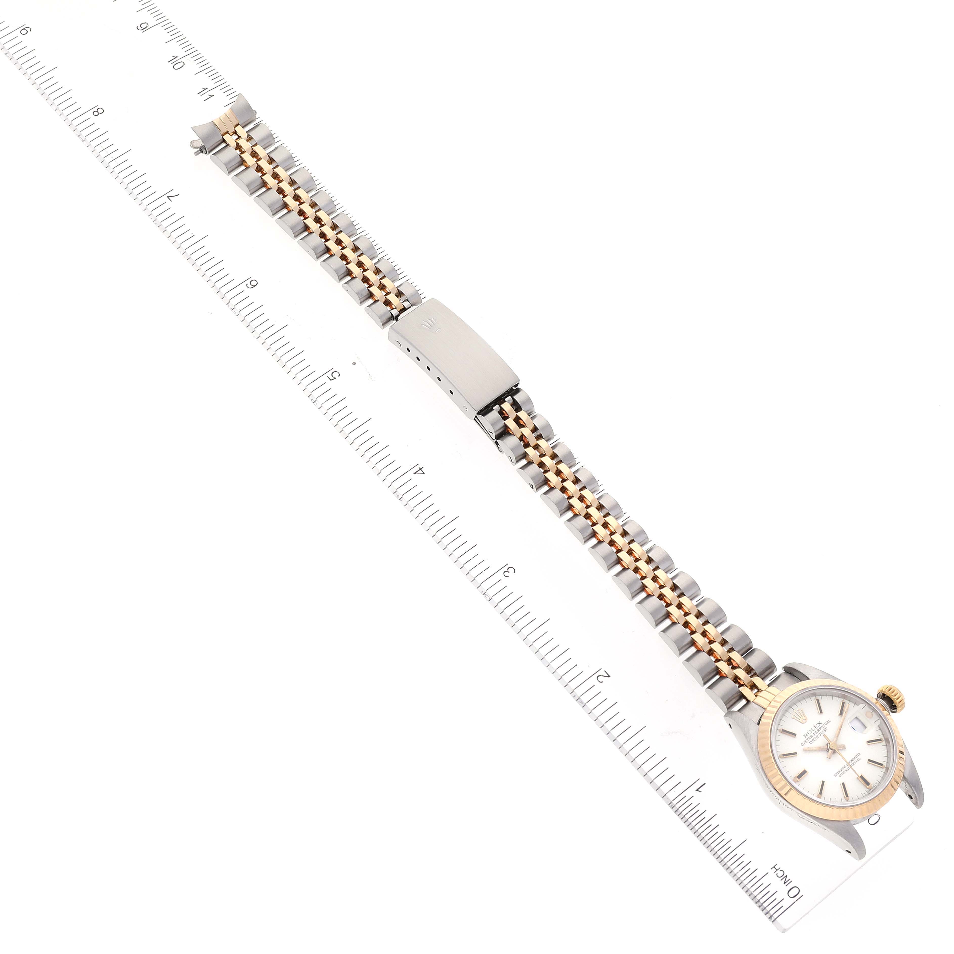 The image shows a Rolex Datejust 69173 Women's Steel and Gold (two tone) White Dial 69173 Women's Steel and Gold (two tone) White Dial watch from an overhead angle, displaying the full watch including the face, bezel, bracelet, and clasp.