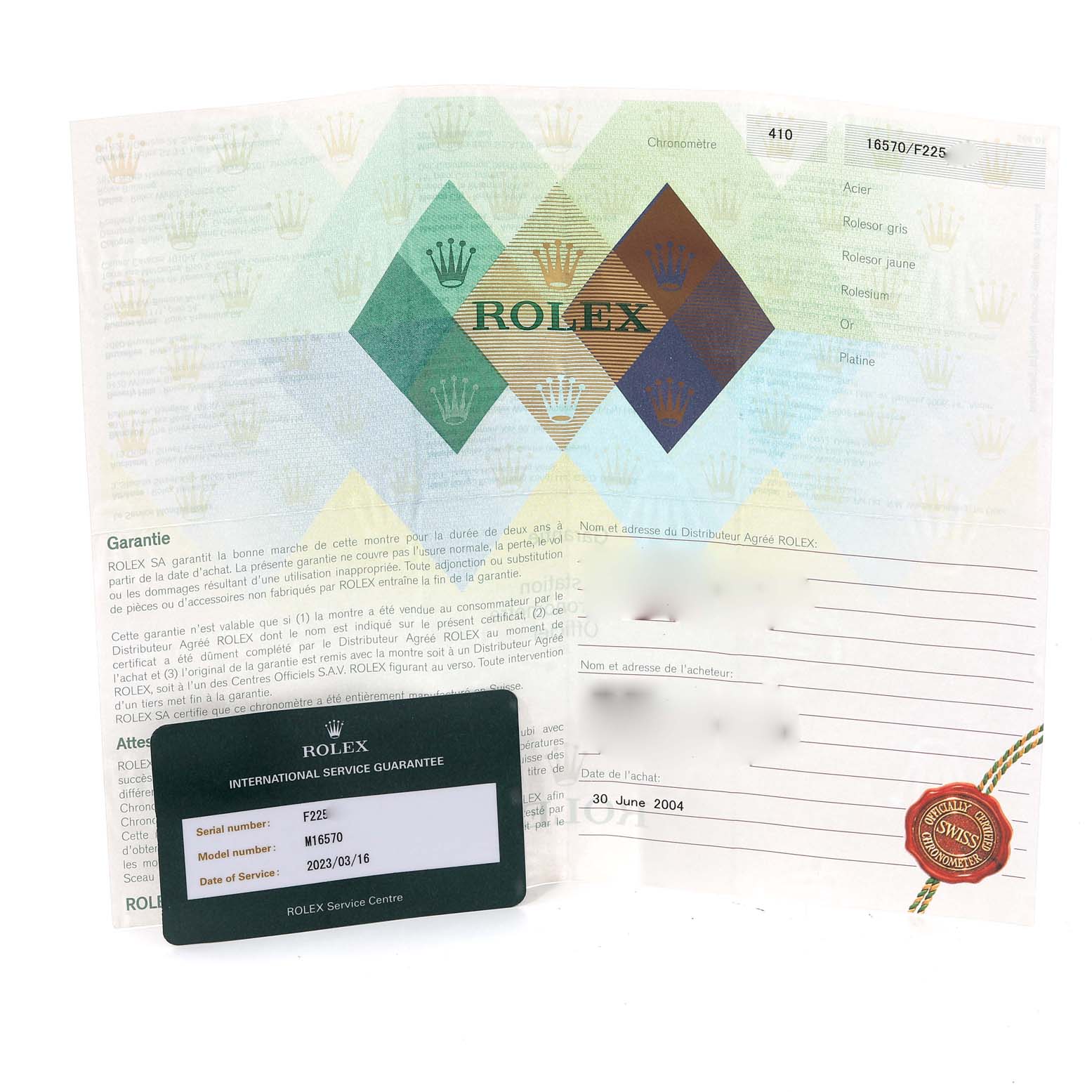 The image shows warranty cards and documents for the Rolex Explorer 16570 Men
s Stainless Steel White Dial 16570 Men
s Stainless Steel White Dial model.