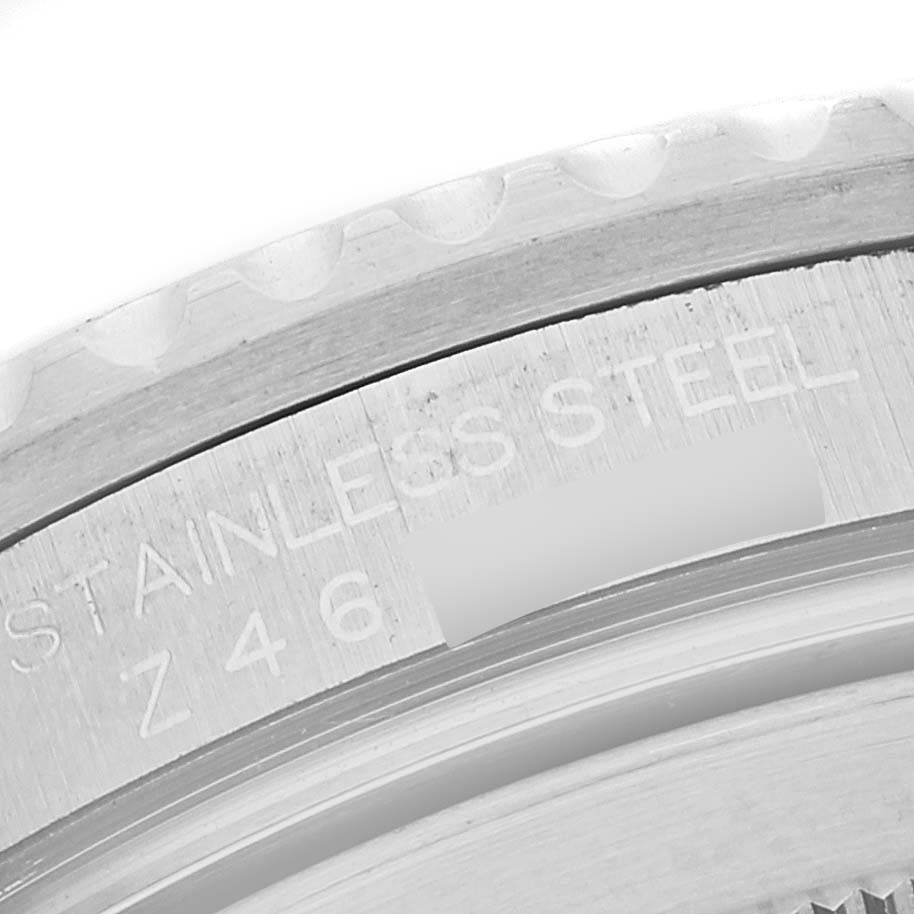 This is a close-up of the Rolex GMT-Master 16710 Men
s Stainless Steel Black Dial 16710 Men
s Stainless Steel Black Dial
s stainless steel case, focusing on the engraved details.