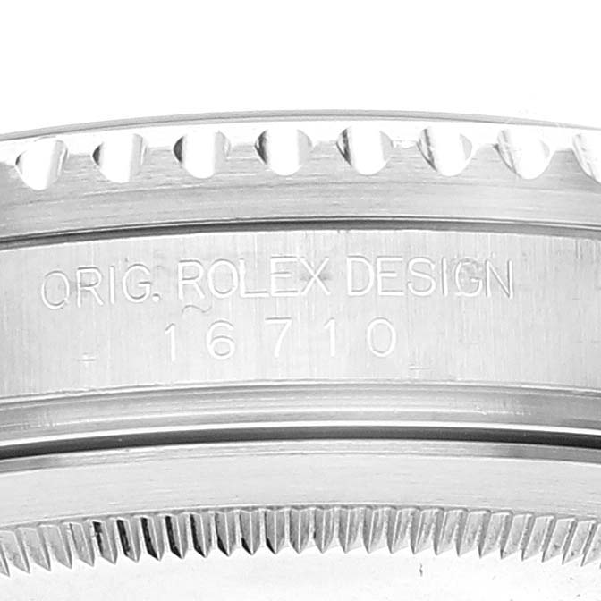 This is a close-up view of the side engraving on the bezel of a Rolex GMT-Master 16710 Men
s Stainless Steel Black Dial 16710 Men
s Stainless Steel Black Dial model, showing the model number 16710.