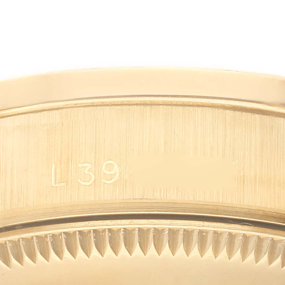 The image shows a close-up of the side of the case and the edge of the bezel of a Rolex President 68288 Women
s Yellow Gold Champagne Dial 68288 Women
s Yellow Gold Champagne Dial model watch.