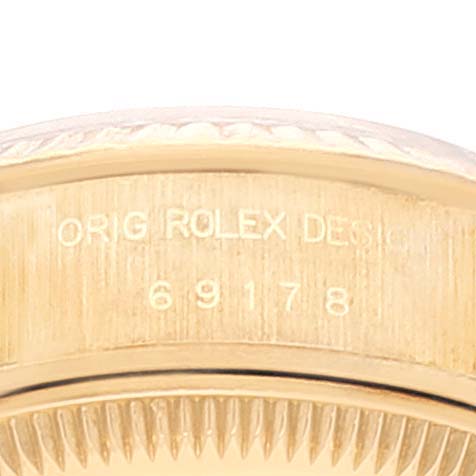 This image shows a close-up of the case back and rehaut of the Rolex President 69178 Women
s Yellow Gold Champagne Dial 69178 Women
s Yellow Gold Champagne Dial model, showcasing its design and model number 69178.