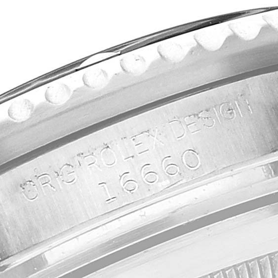 This close-up image shows the model number "16660" and "ORIG ROLEX DESIGN" engraving on the case of the Rolex Vintage Collection 16660 Men's Stainless Steel Black Dial 16660 Men's Stainless Steel Black Dial watch.