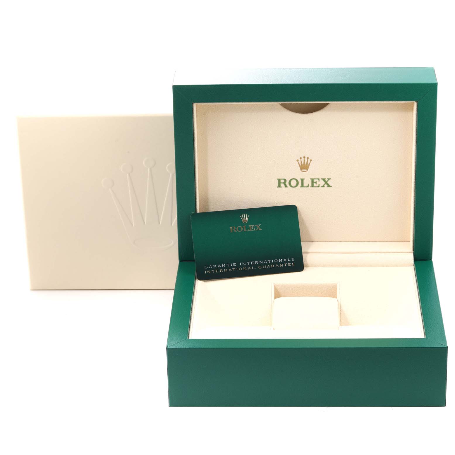 This image shows an open green and beige Rolex Submariner 126618 Men's Yellow Gold Black Dial 126618 Men's Yellow Gold Black Dial watch box with an international guarantee card inside.