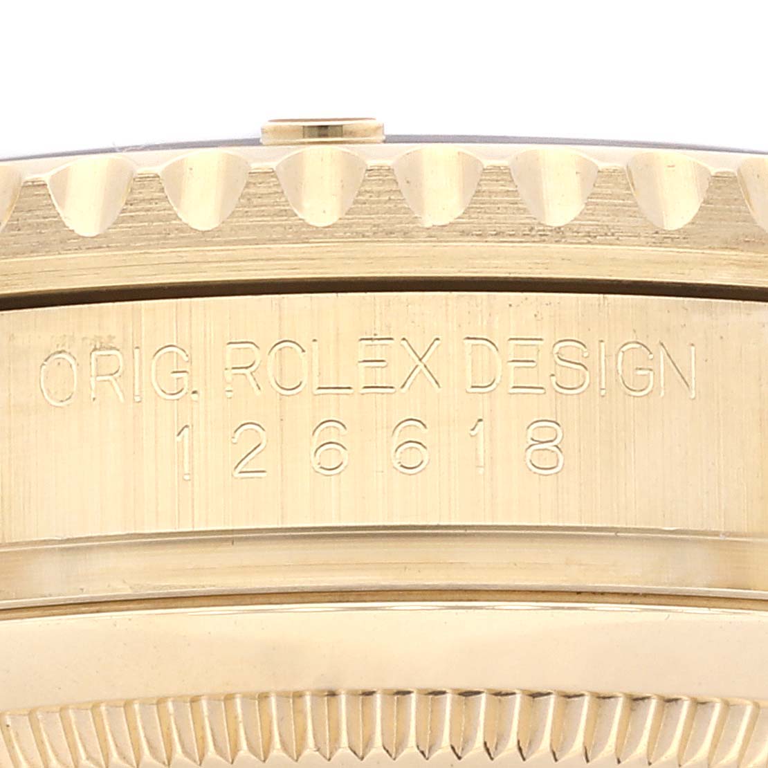 The image shows a close-up of the side of the Rolex Submariner 126618 Men's Yellow Gold Black Dial 126618 Men's Yellow Gold Black Dial watch case, highlighting the engraved model number 126618.