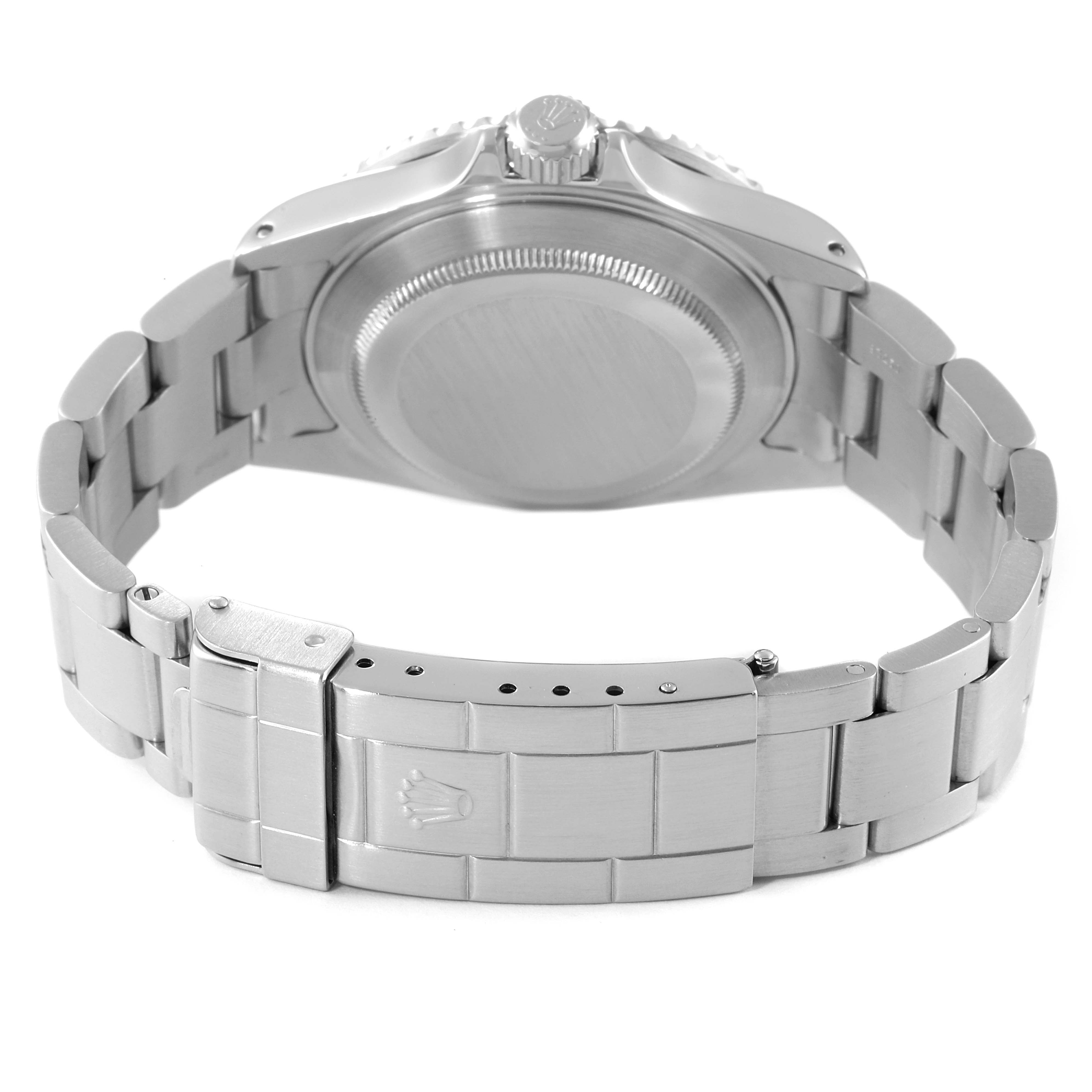 The image shows the back view of a Rolex Submariner 16610 Men
s Stainless Steel Black Dial 16610 Men
s Stainless Steel Black Dial, highlighting the bracelet and clasp.