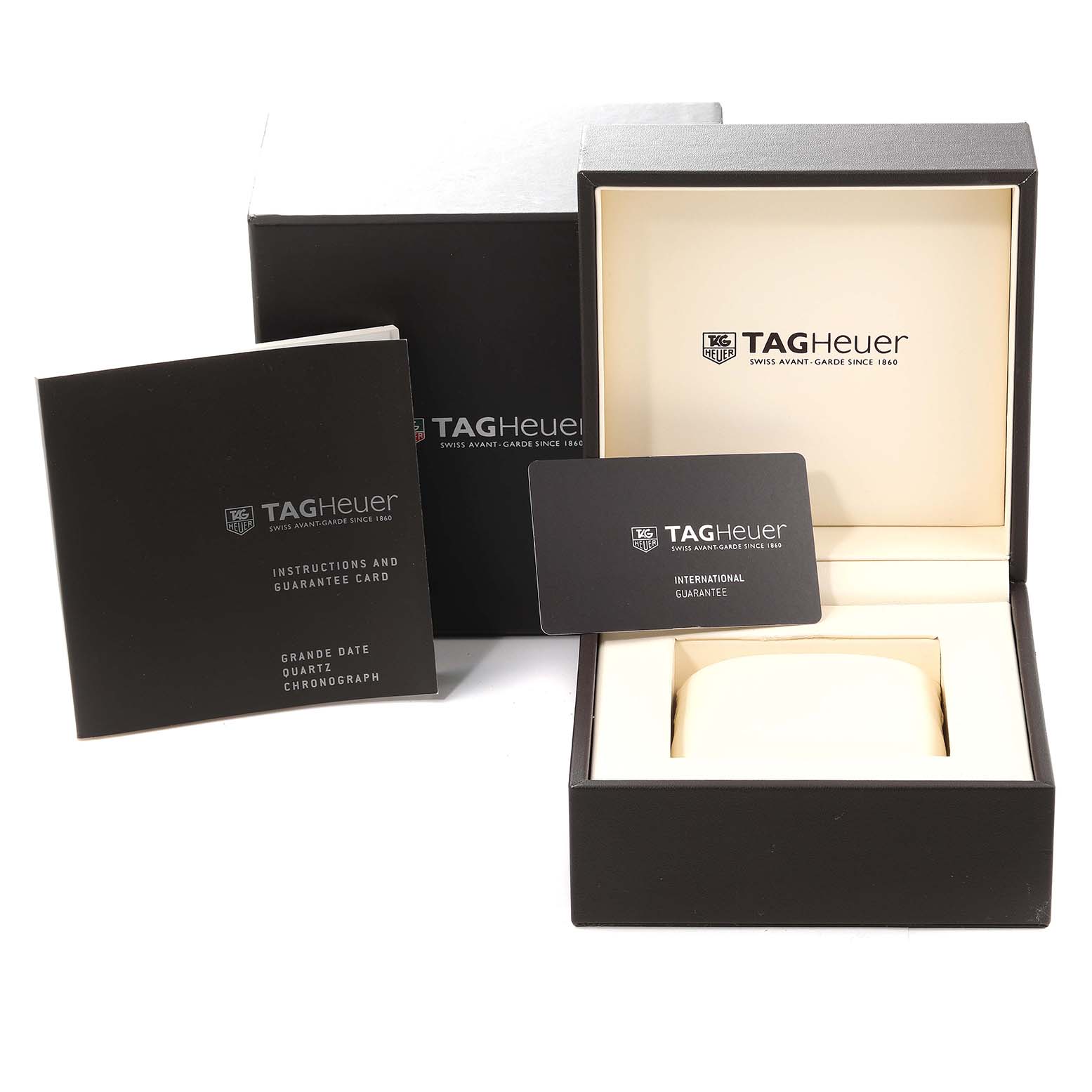 The image shows the Aquaracer model by Tag Heuer's packaging, including the box, instruction booklet, and guarantee card.