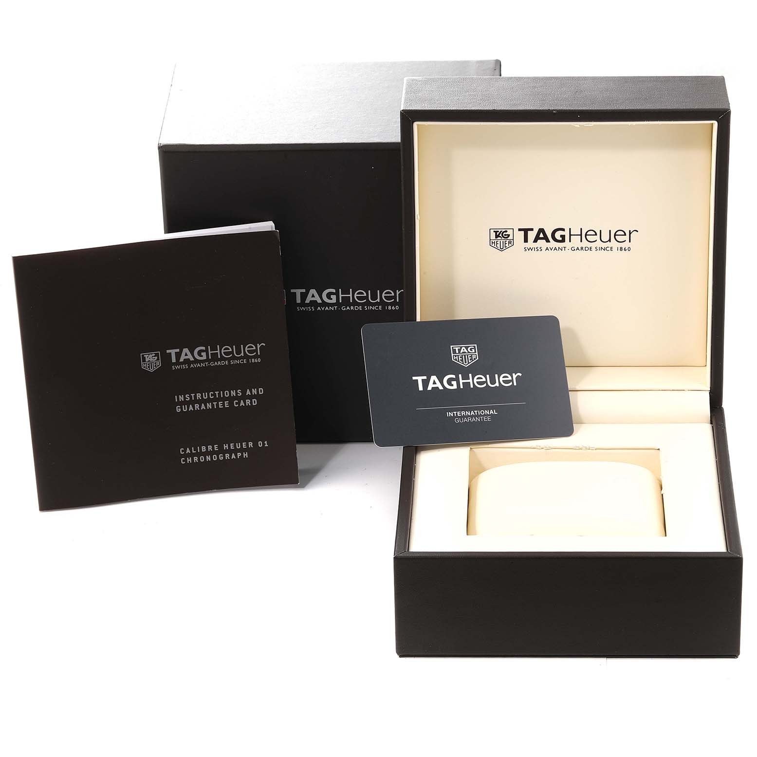 The image shows the packaging and accessories for the Tag Heuer Carrera CAR2A90.FT6071 Men's Ceramic Black Dial CAR2A90.FT6071 Men's Ceramic Black Dial model, including a box, instruction booklet, and guarantee card.