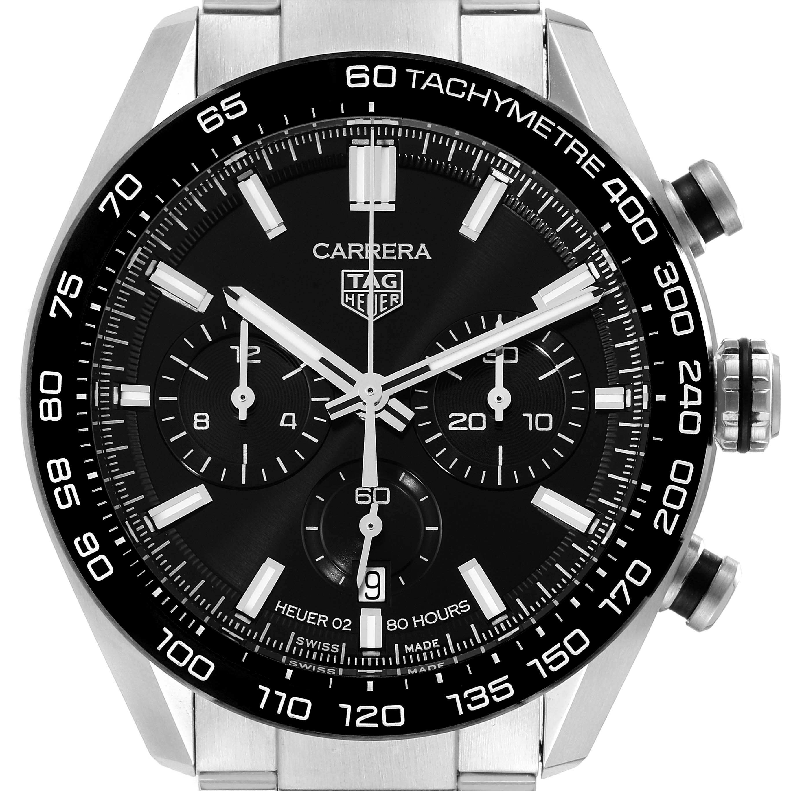 The Carrera model by Tag Heuer is shown from a front angle, displaying the dial, subdials, tachymeter, and crown.