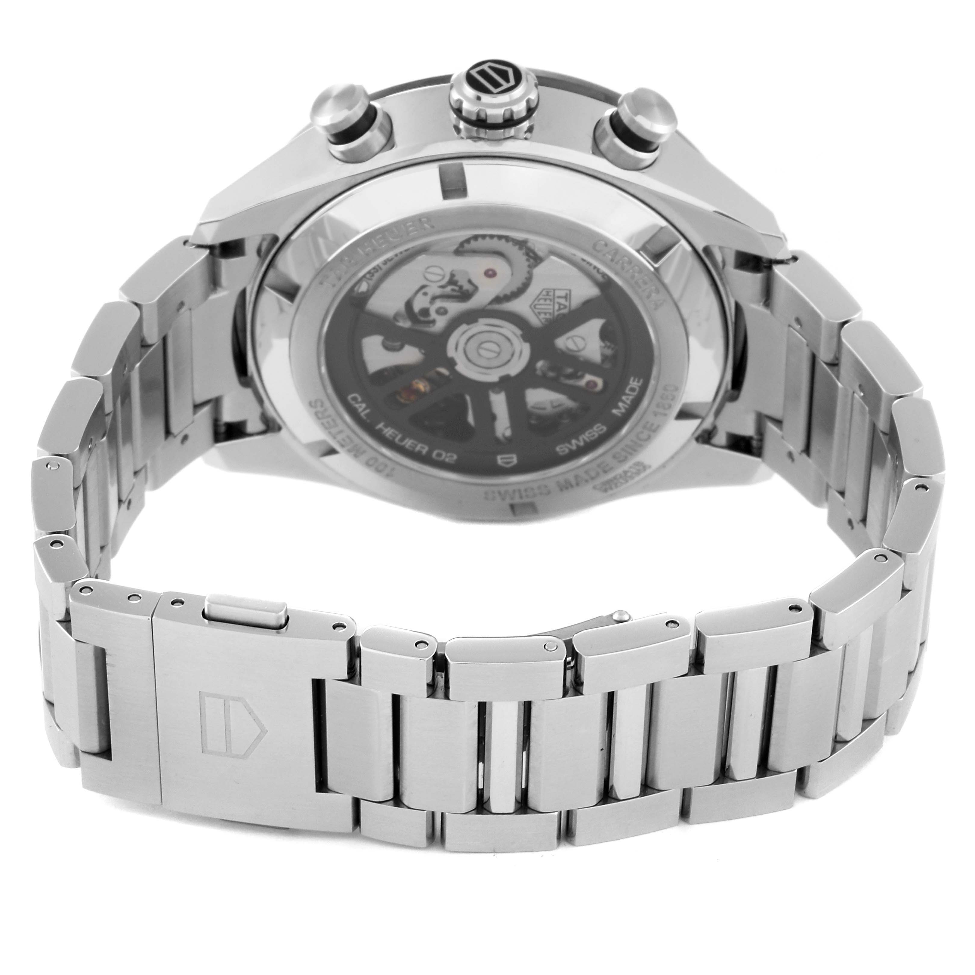 The image shows the back view of a Tag Heuer Carrera CBN2A1B.BA0643 Men's Stainless Steel Black Dial CBN2A1B.BA0643 Men's Stainless Steel Black Dial watch, highlighting its stainless steel bracelet and exposed movement.