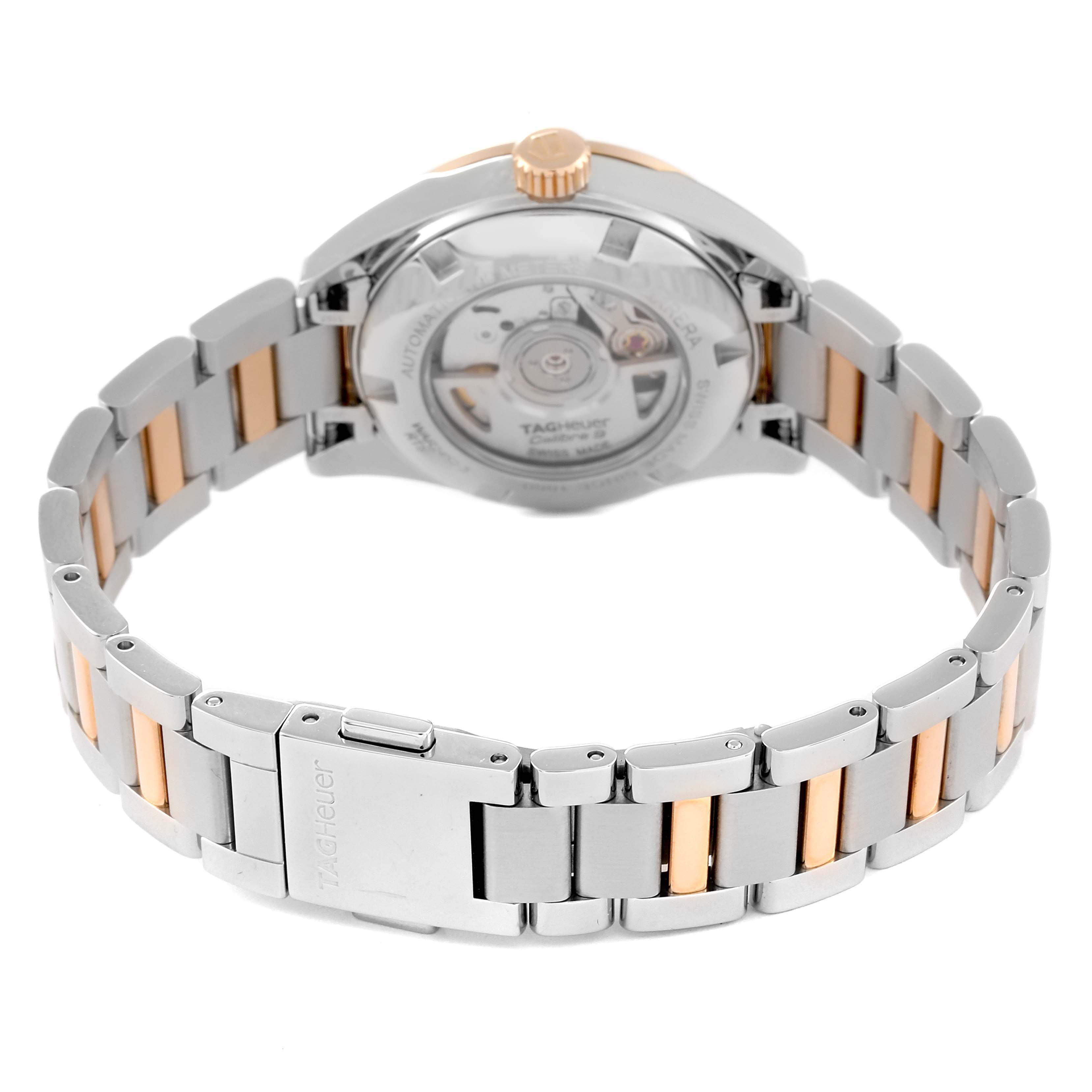 The image shows the back view of a Tag Heuer Carrera WAR2452.BD0777 Women's Steel and Gold (two tone) Mother of Pearl Dial WAR2452.BD0777 Women's Steel and Gold (two tone) Mother of Pearl Dial watch, highlighting the back case, crown, and metal strap.