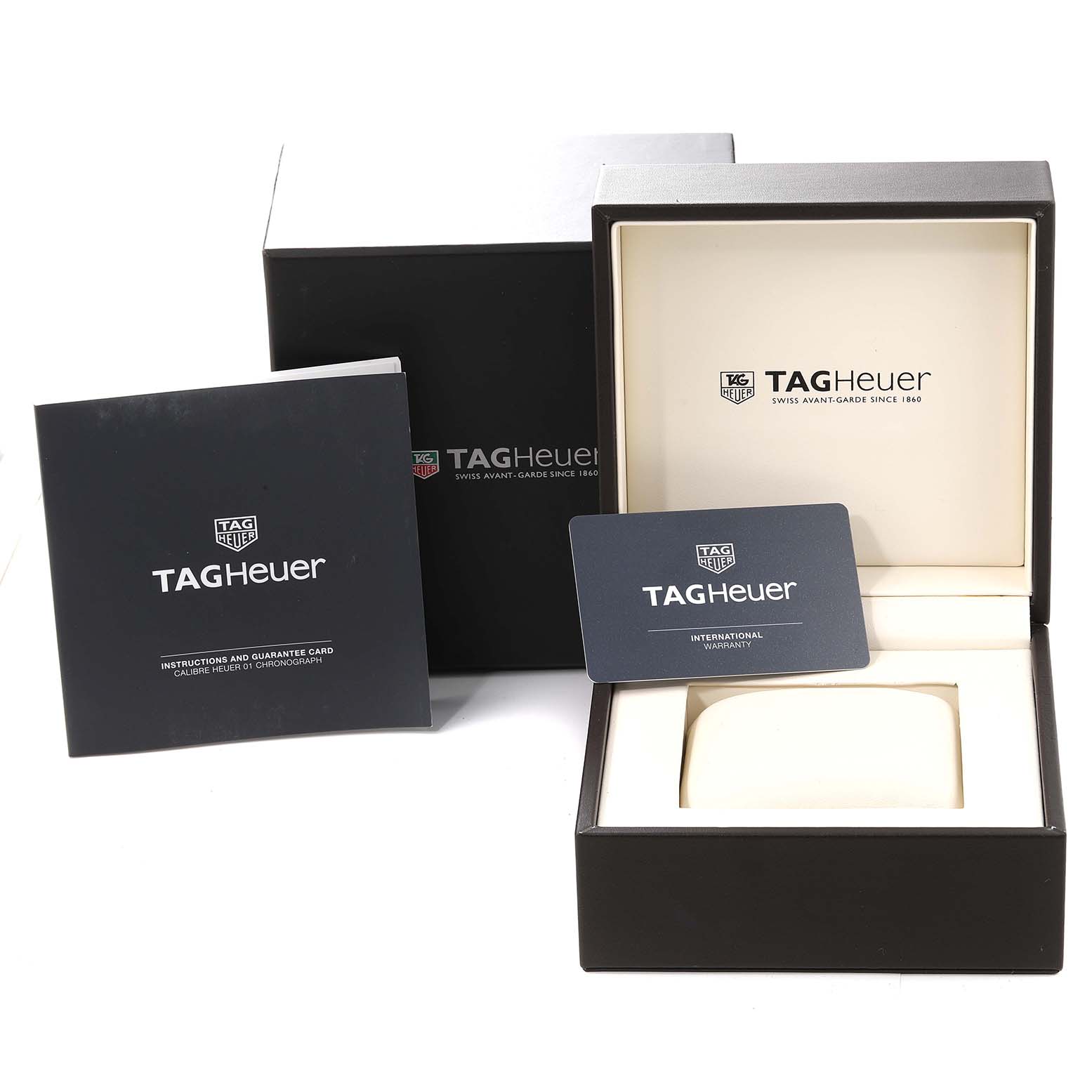 The image shows the box, instruction manual, and warranty card for the Tag Heuer Carrera CAR201V.BA0714 Men's Stainless Steel Black Dial CAR201V.BA0714 Men's Stainless Steel Black Dial watch.