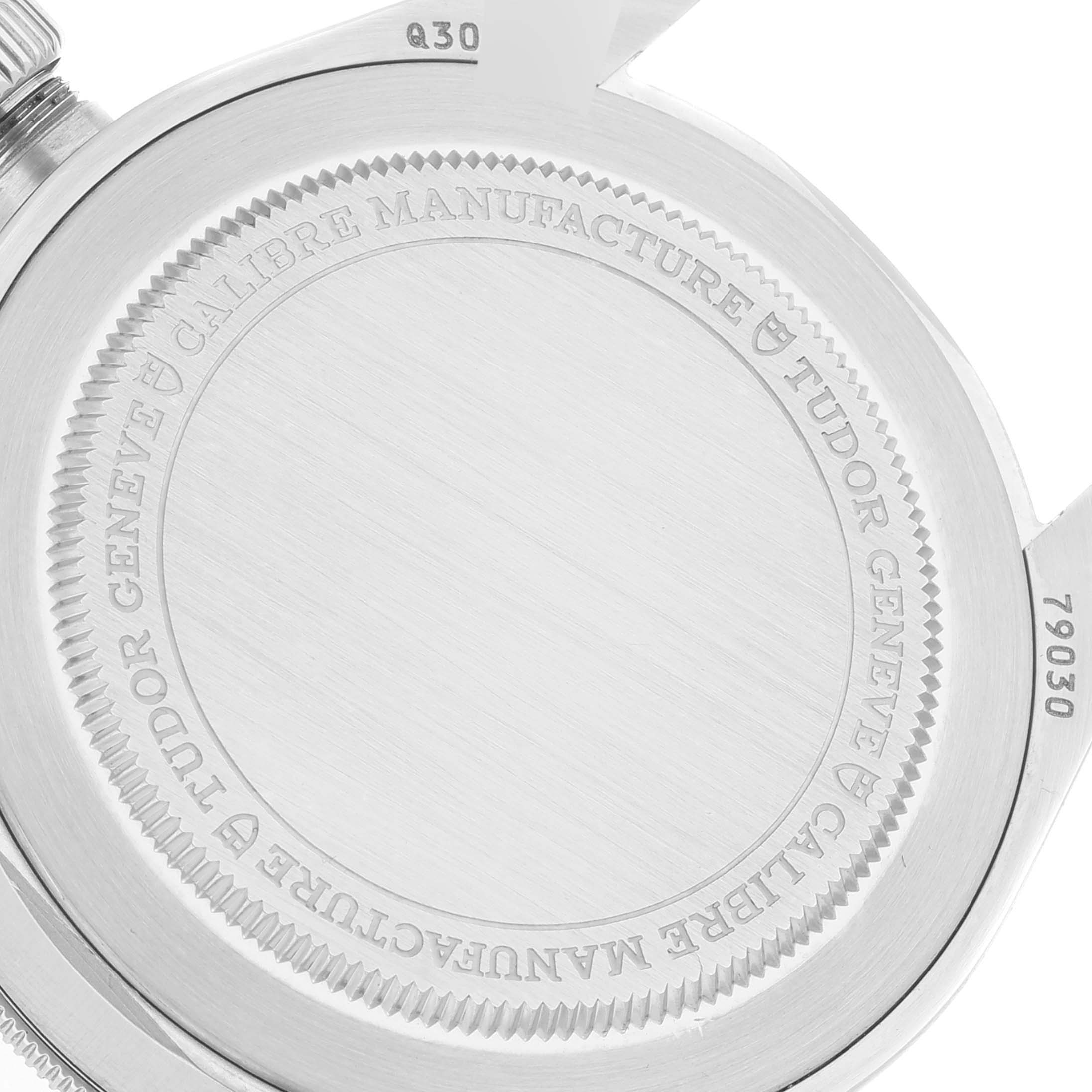 The image shows the rear case back of the Tudor Heritage Black Bay M79030N-0001 Men
s Stainless Steel Black Dial M79030N-0001 Men
s Stainless Steel Black Dial watch with engraved details.