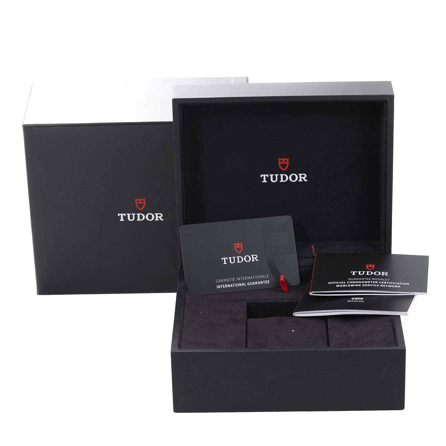 This image shows the packaging and accessories for the Tudor Heritage Black Bay 79833MN Men's Steel and Gold (two tone) Black Dial 79833MN Men's Steel and Gold (two tone) Black Dial watch, including the box, international guarantee card, and user manual.