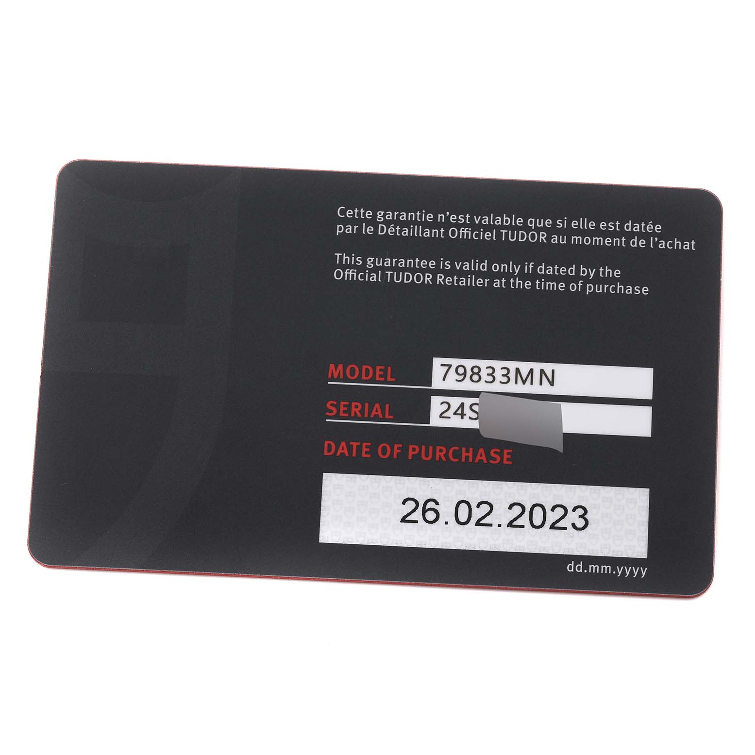 The image shows a warranty card for the Tudor Heritage Black Bay 79833MN Men's Steel and Gold (two tone) Black Dial 79833MN Men's Steel and Gold (two tone) Black Dial model 79833MN, displaying the model, serial number, and date of purchase.