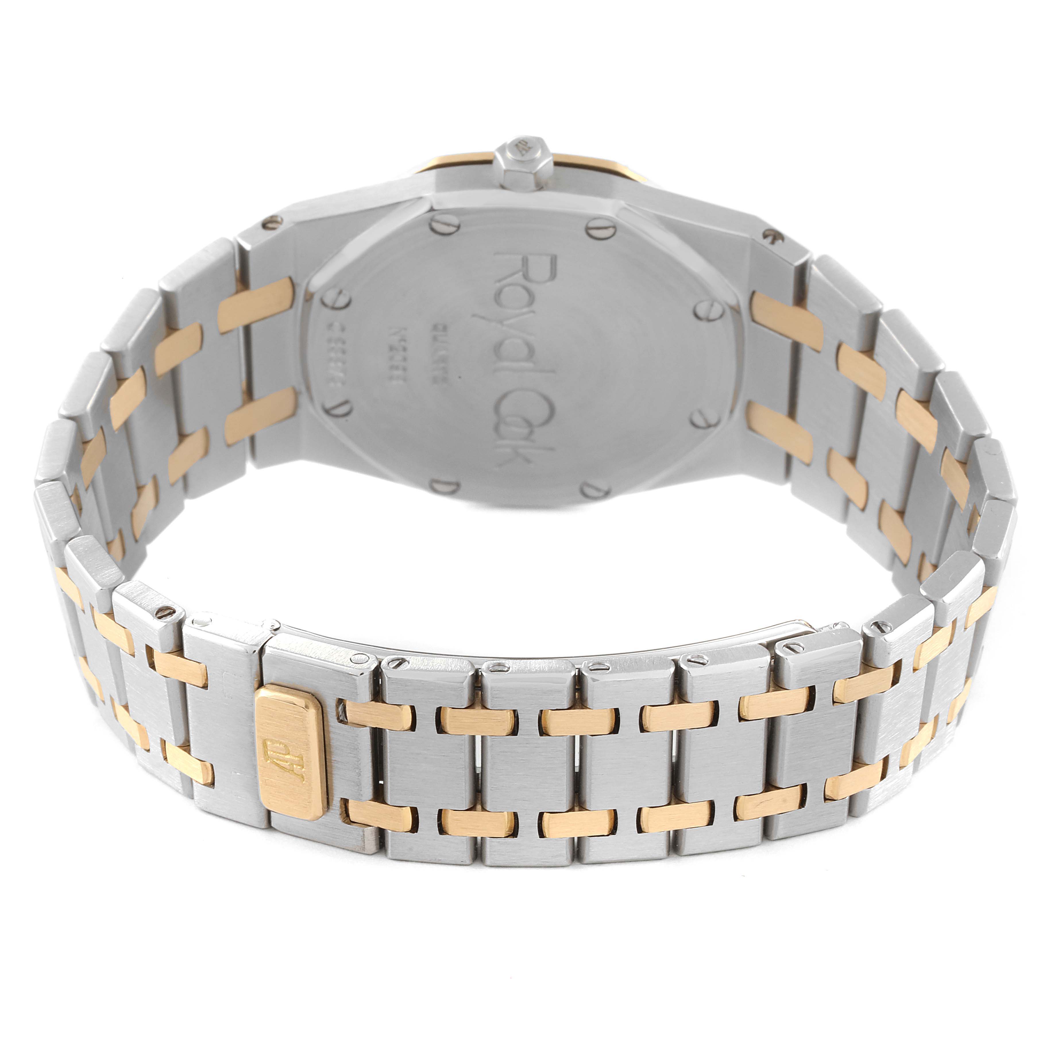 The image shows the back of an Audemars Piguet Royal Oak 56303SA Women's Steel and Gold (two tone) Champagne Dial 56303SA Women's Steel and Gold (two tone) Champagne Dial watch with a two-tone metal bracelet.