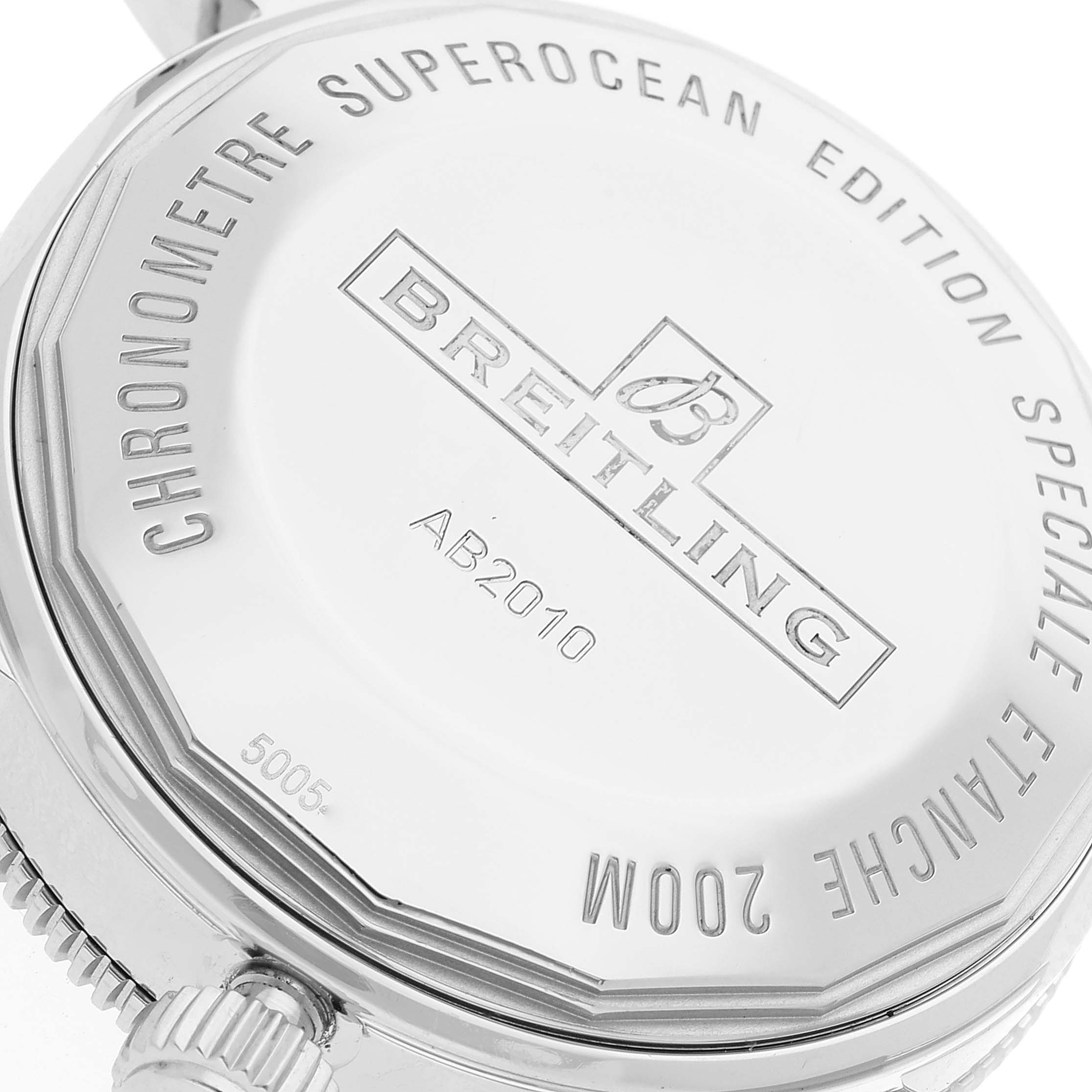 The image shows the case back of a Breitling Superocean AB2010 Men's Stainless Steel Black Dial AB2010 Men's Stainless Steel Black Dial watch, highlighting the engraved branding and model details.