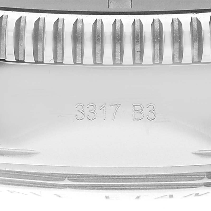 The image shows a close-up of the side of a Breitling Superocean AB2010 Men's Stainless Steel Black Dial AB2010 Men's Stainless Steel Black Dial watch, focusing on the bezel and case with engraved markings "3317 B3."