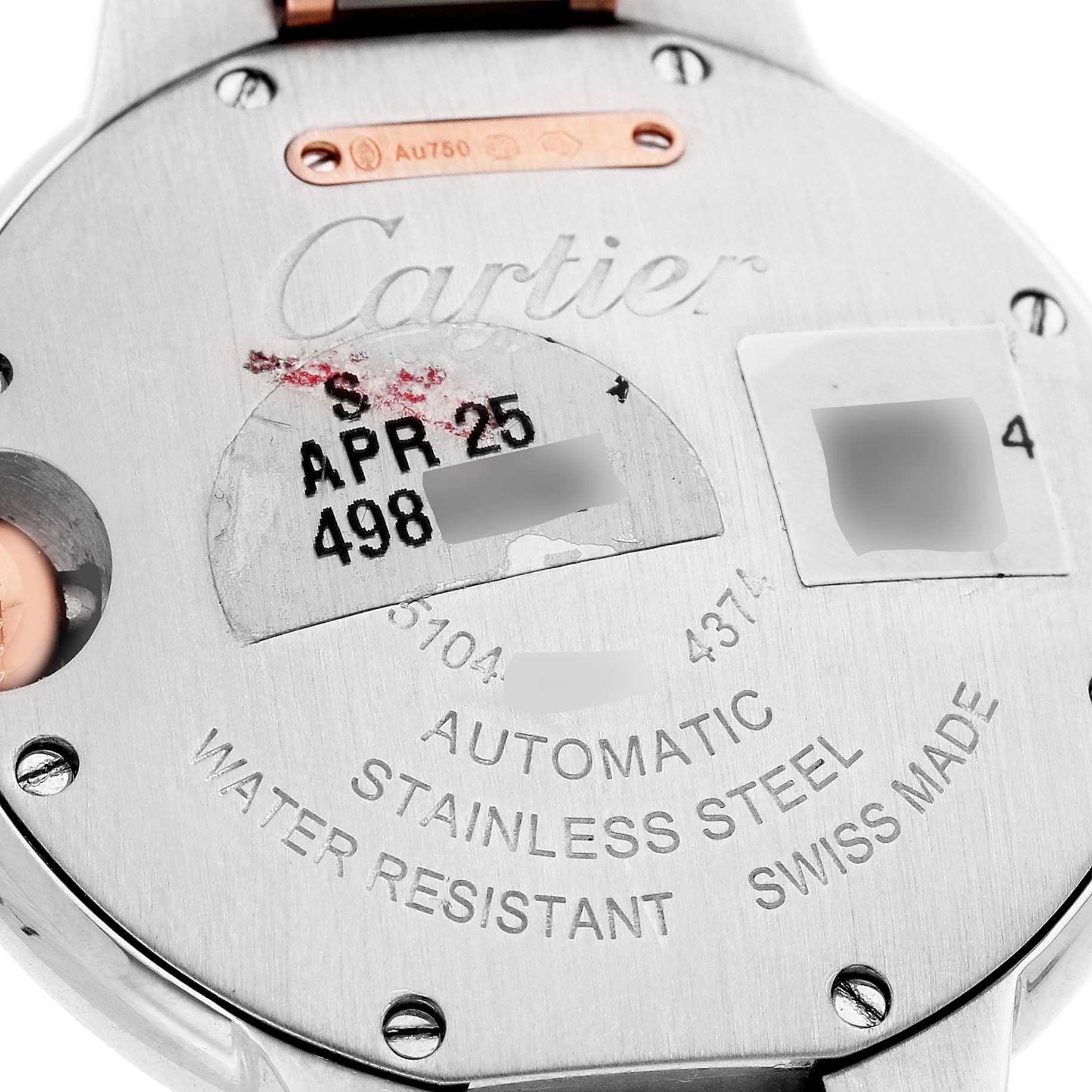 The image shows the back of the Cartier Ballon Bleu W3BB0023 Women's Steel and Gold (two tone) White Dial watch, highlighting engravings and certification markings.