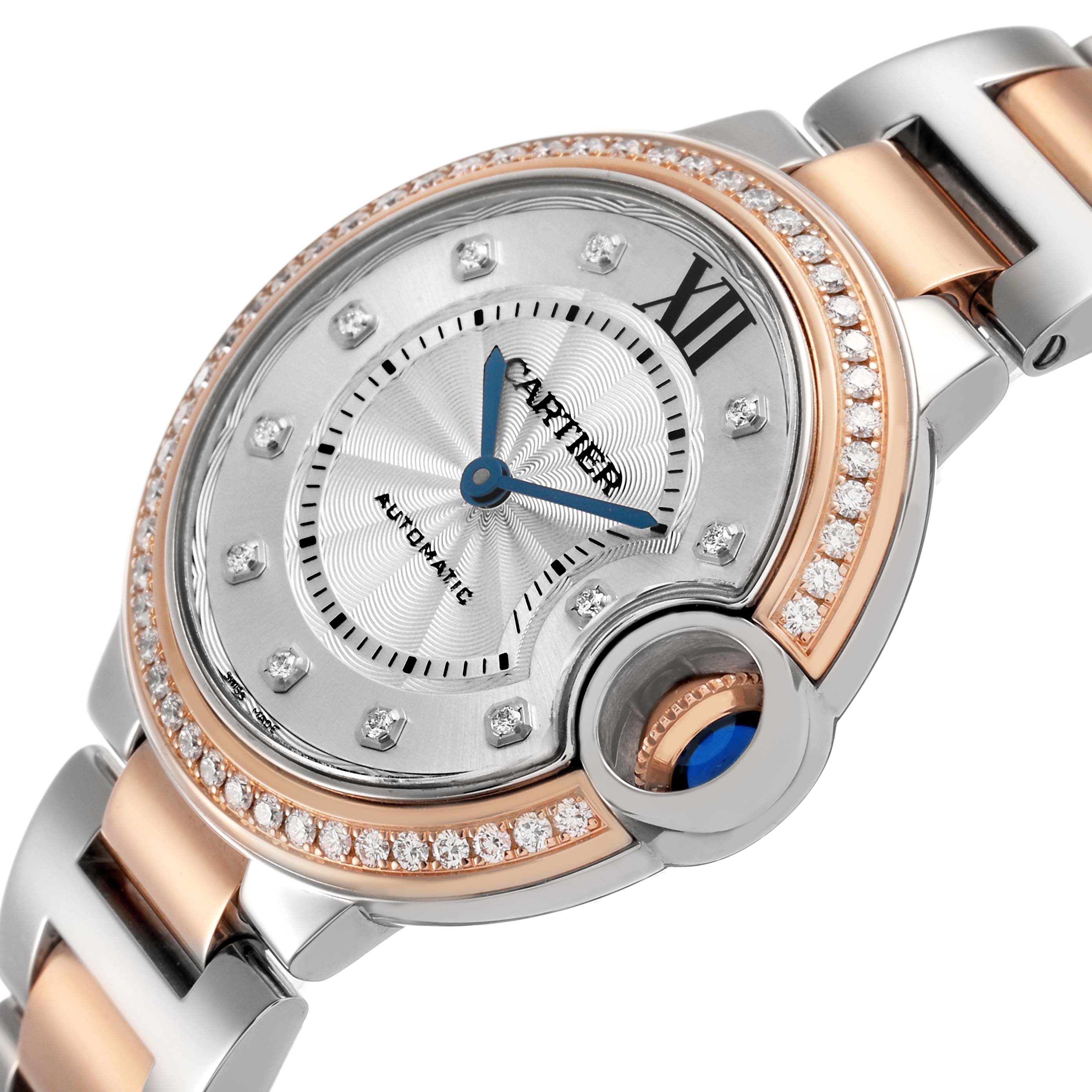 The Cartier Ballon Bleu W3BB0023 Women's Steel and Gold (two tone) White Dial watch is shown at a tilted angle, highlighting the face, crown, and bracelet.