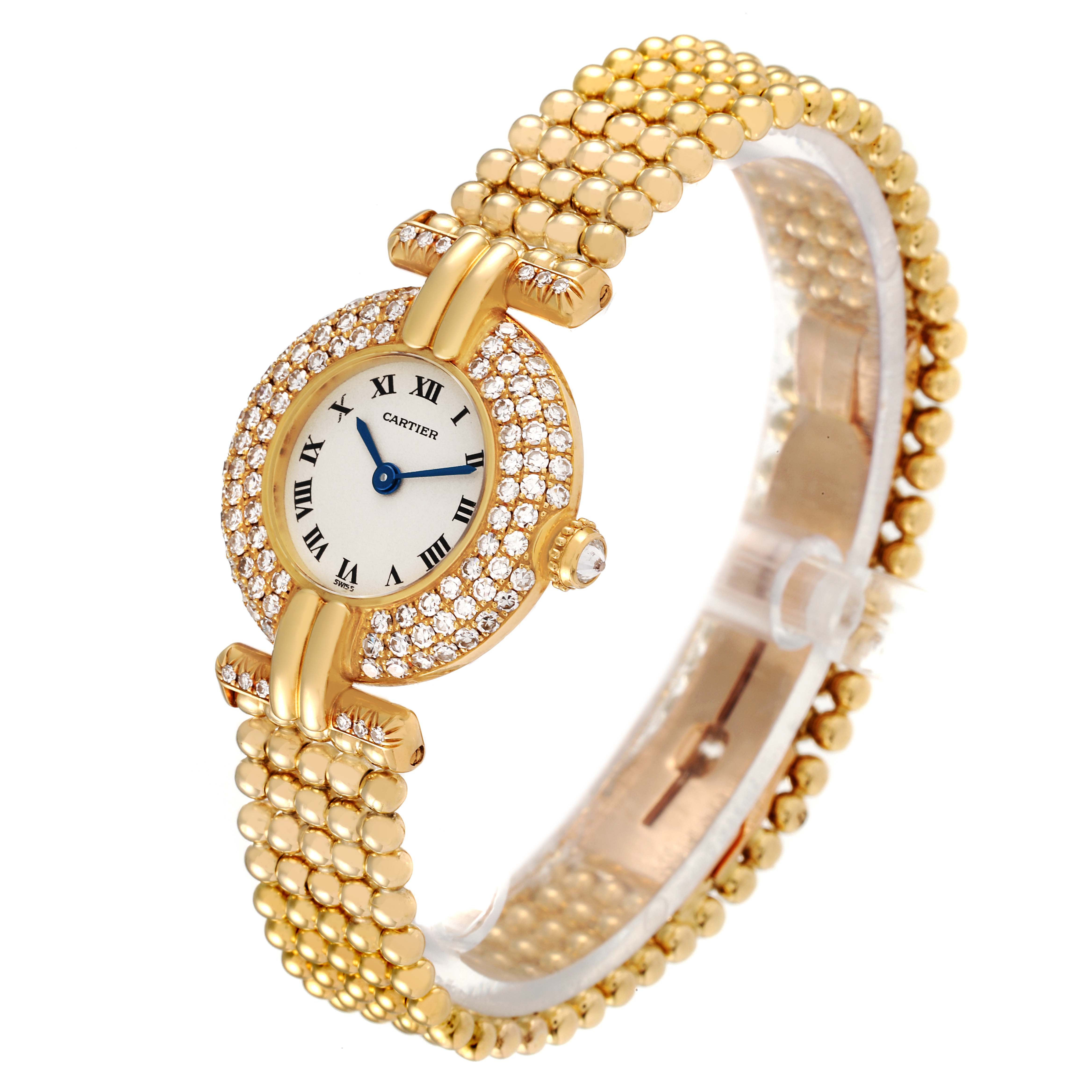 The Cartier Colisee WB1018A8 Women's Yellow Gold Silver Dial WB1018A8 Women's Yellow Gold Silver Dial watch is shown at an angled view, highlighting its gold, diamond-encrusted case and bracelet.