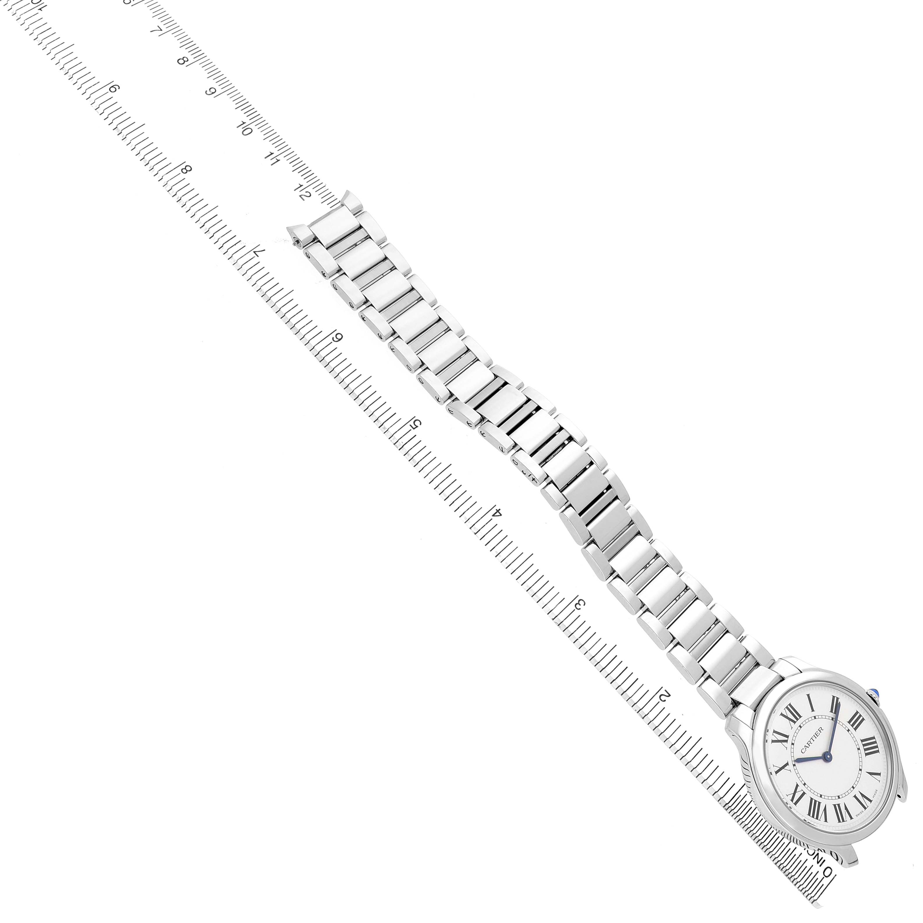 The Cartier Ronde WSRN0034 Men's Stainless Steel Silver Dial watch is displayed at an angled top-down view, showcasing its face and full bracelet alongside a ruler for scale.