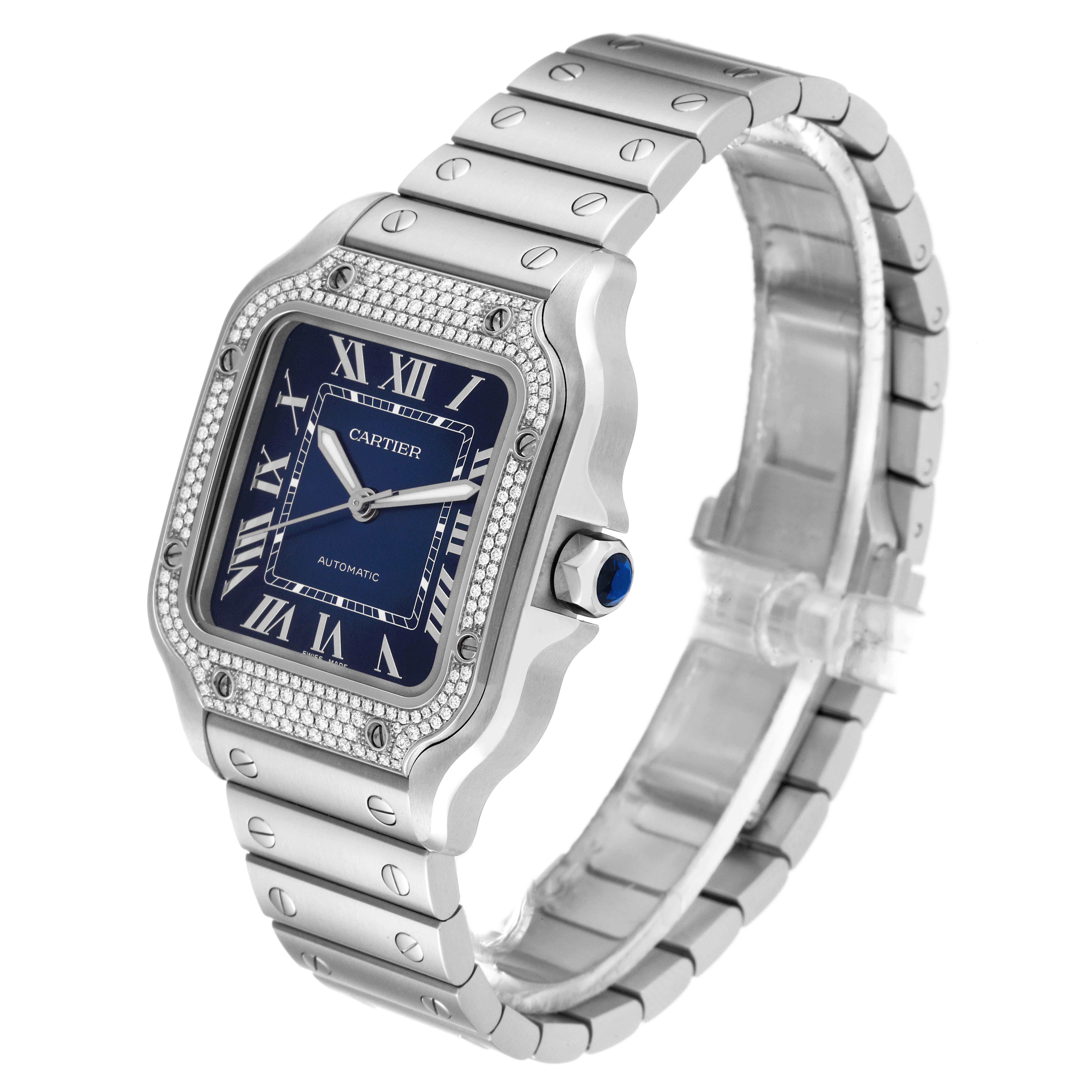The image shows a Cartier Santos W4SA0006 Men's Stainless Steel Blue Dial W4SA0006 Men's Stainless Steel Blue Dial watch at an angled view, highlighting its blue dial, metal bracelet, and diamond-set bezel.