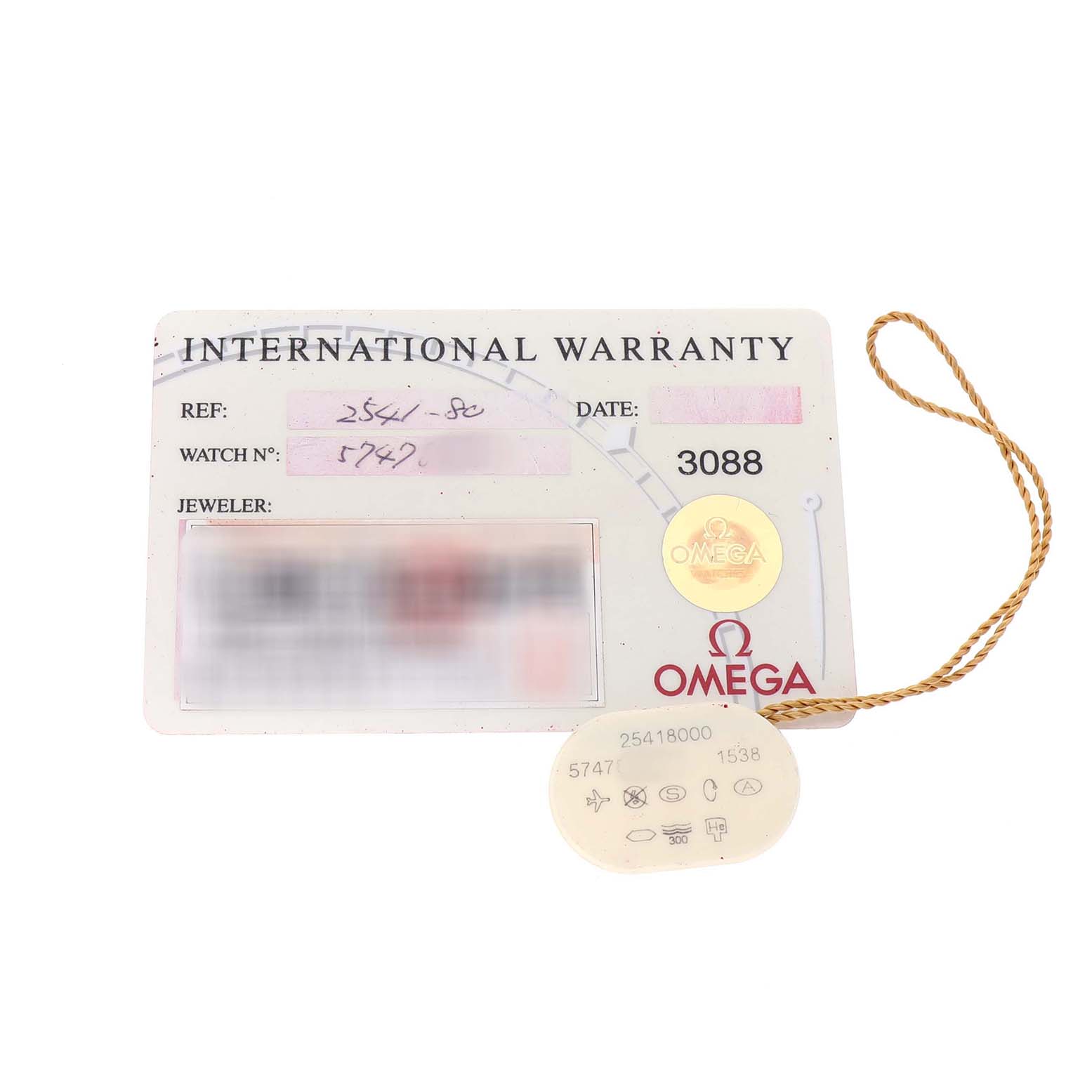 The image shows an international warranty card and a tag for the Omega Seamaster 2541.80.00 Men's Stainless Steel Blue Dial model, viewed from above.
