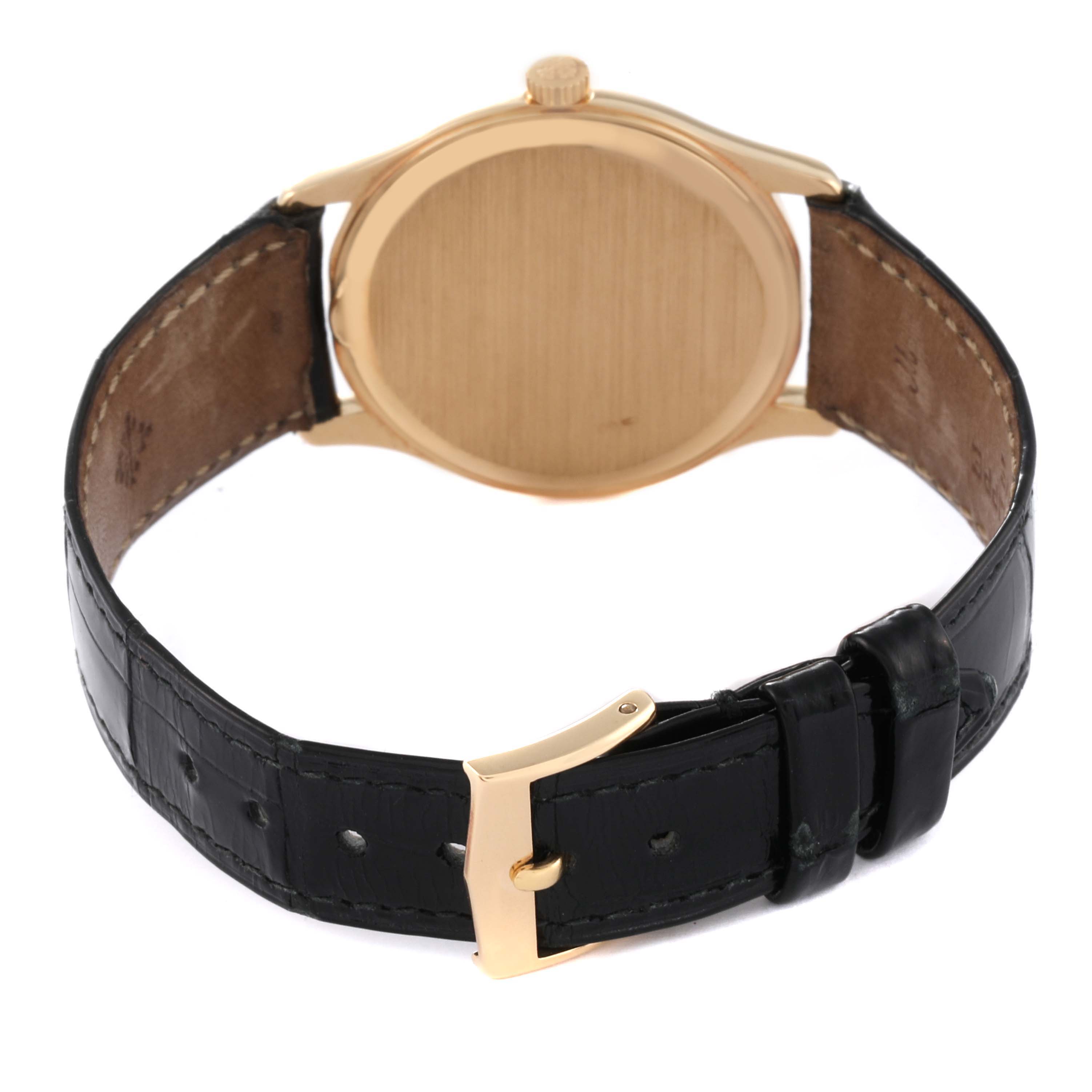 The image shows the back view of a Patek Philippe Calatrava 3923J Men's Yellow Gold Silver Dial 3923J Men's Yellow Gold Silver Dial watch, featuring a leather strap and a closed case back.