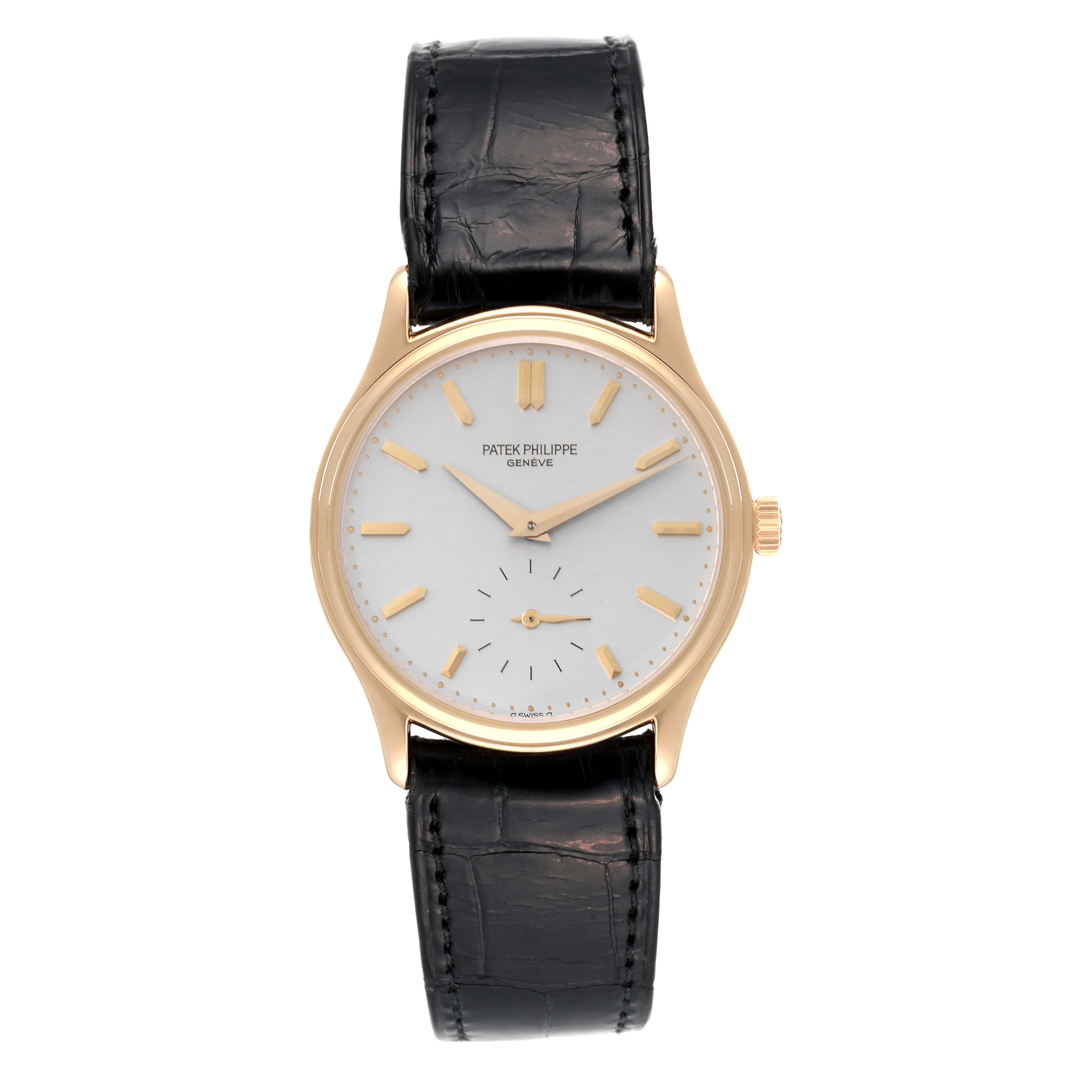 The image shows a front view of a Patek Philippe Calatrava 3923J Men's Yellow Gold Silver Dial 3923J Men's Yellow Gold Silver Dial watch, featuring its dial, hands, case, and leather strap.