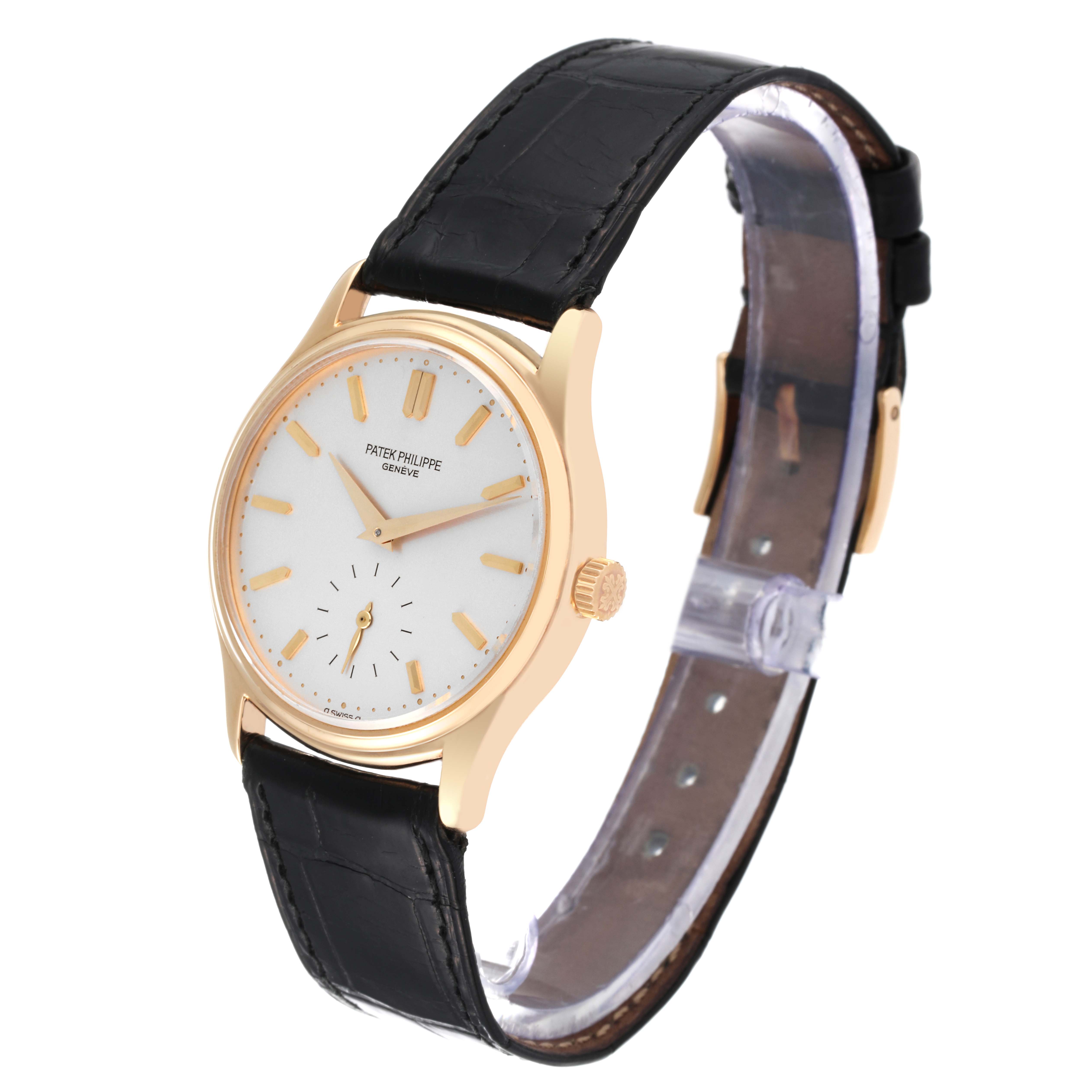 The image shows a side angle of a Patek Philippe Calatrava 3923J Men's Yellow Gold Silver Dial 3923J Men's Yellow Gold Silver Dial watch, featuring the face, crown, and leather strap.