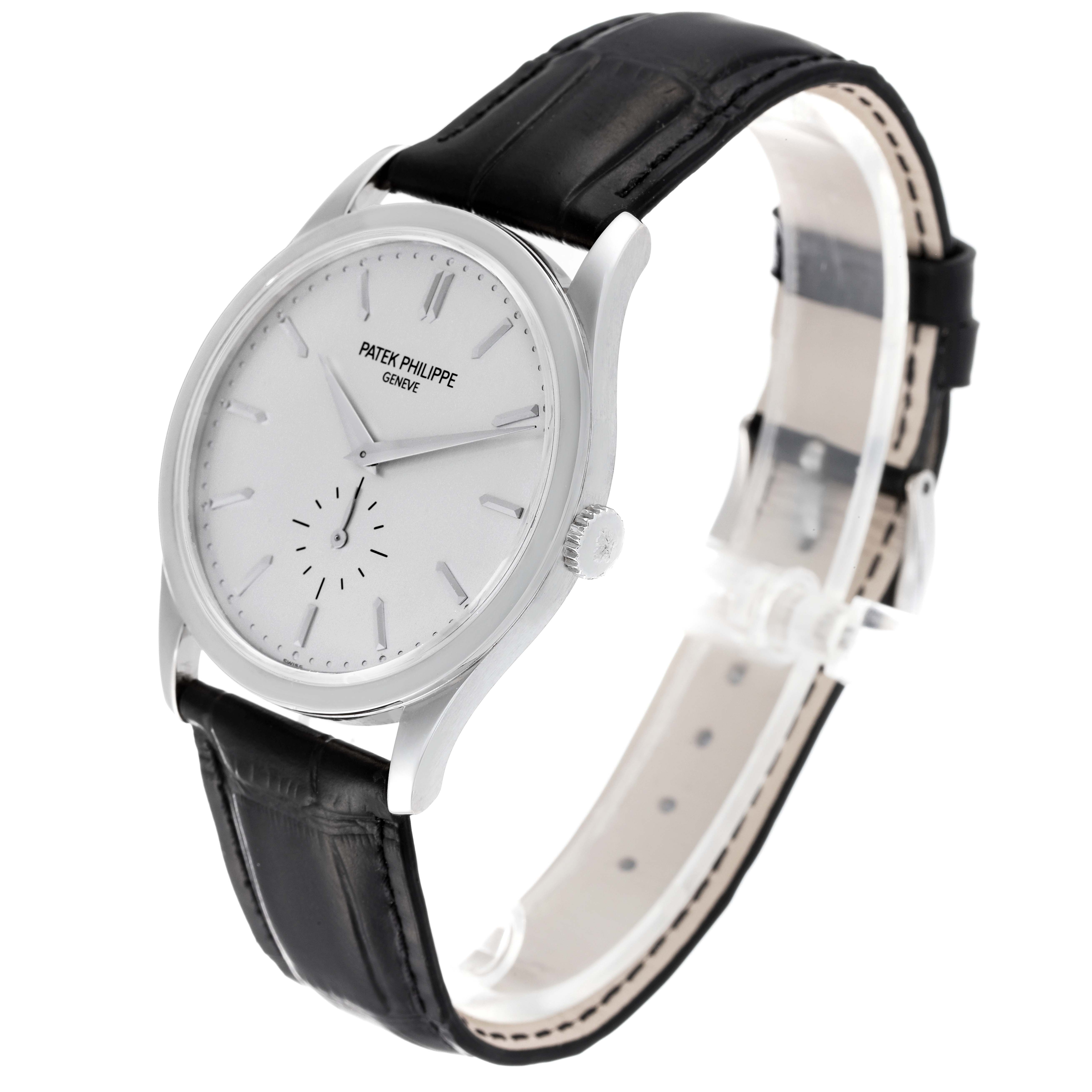 The image shows a side-angle view of a Patek Philippe Calatrava 5196G Men's White Gold Silver Dial 5196G Men's White Gold Silver Dial, highlighting its white dial, black leather strap, and silver case.