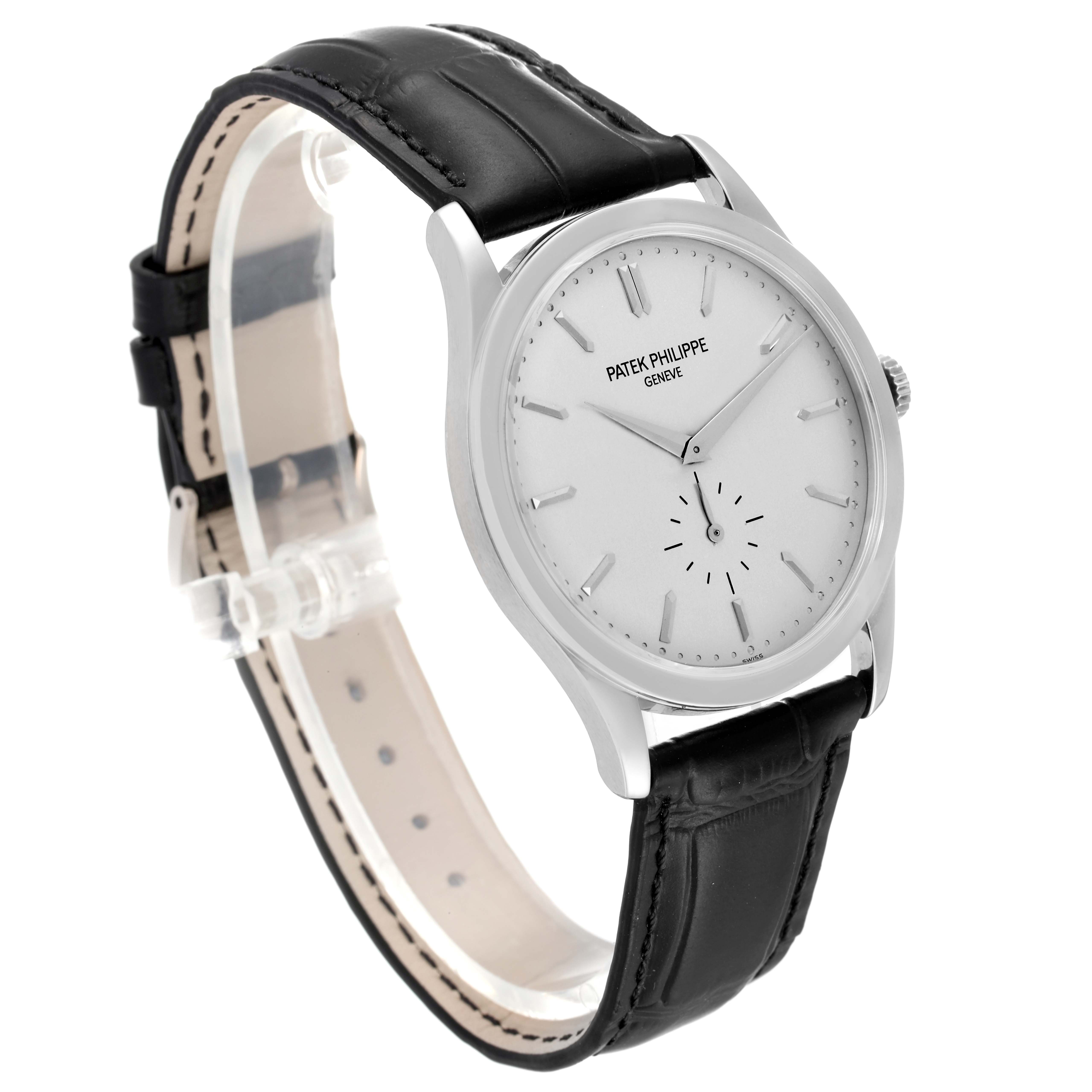 The image shows a Patek Philippe Calatrava 5196G Men's White Gold Silver Dial 5196G Men's White Gold Silver Dial watch at a slight angle, highlighting its black leather strap and white dial.