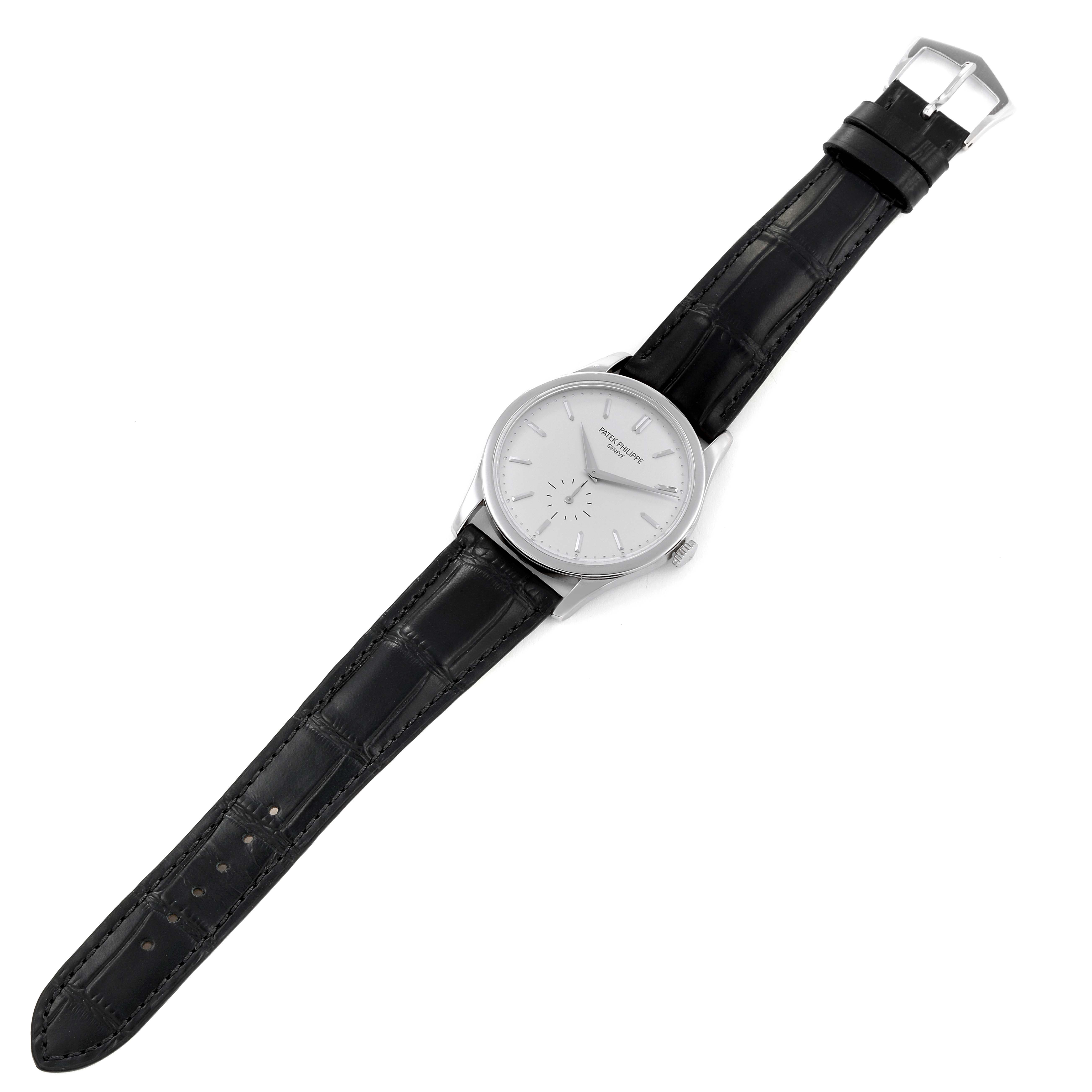 The image shows a Patek Philippe Calatrava 5196G Men's White Gold Silver Dial 5196G Men's White Gold Silver Dial watch with a black leather strap, viewed from an overhead angle.