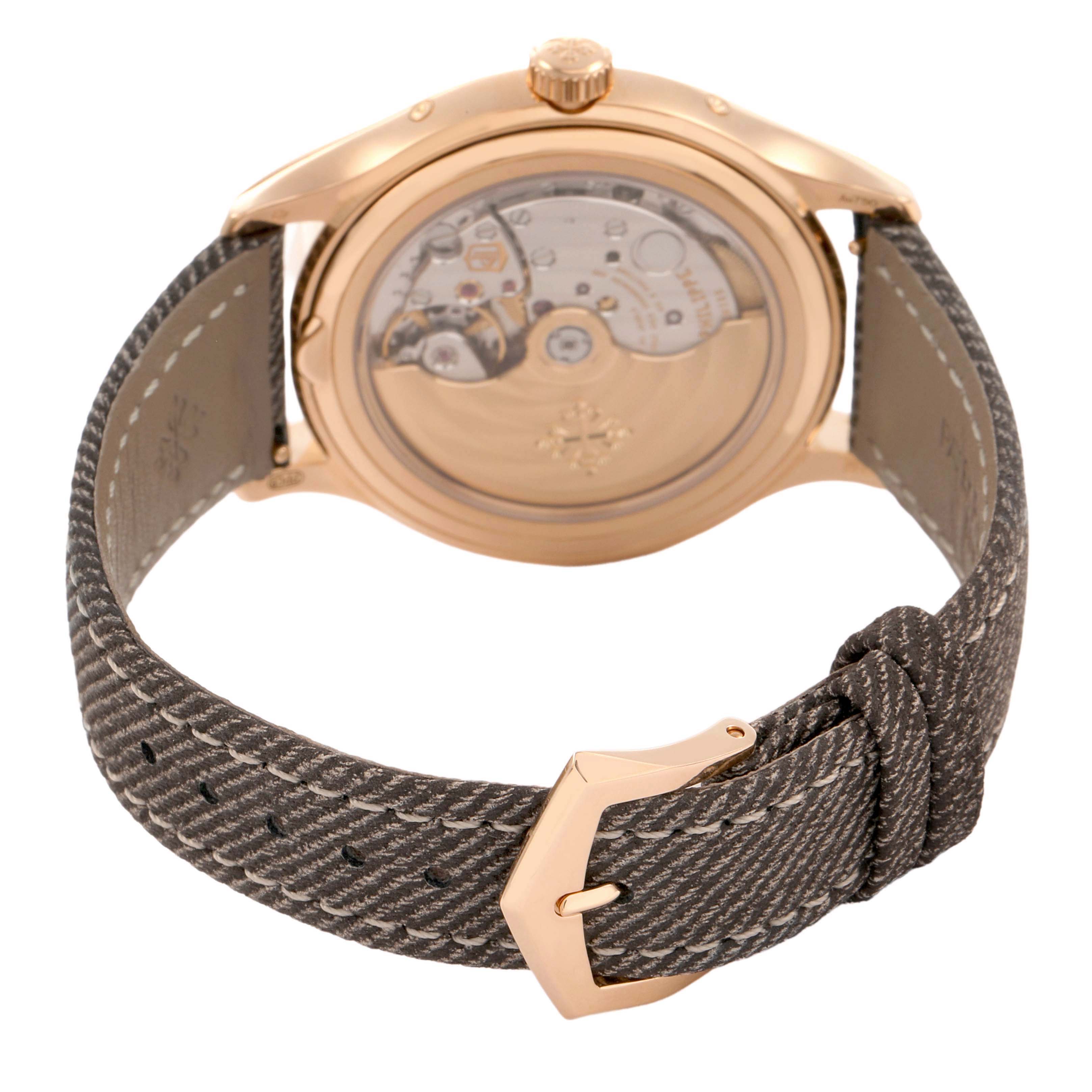 The Patek Philippe Complications 4946R-001 Men's Rose Gold Brown Dial watch is shown from the back, displaying the movement through the transparent case and the strap.