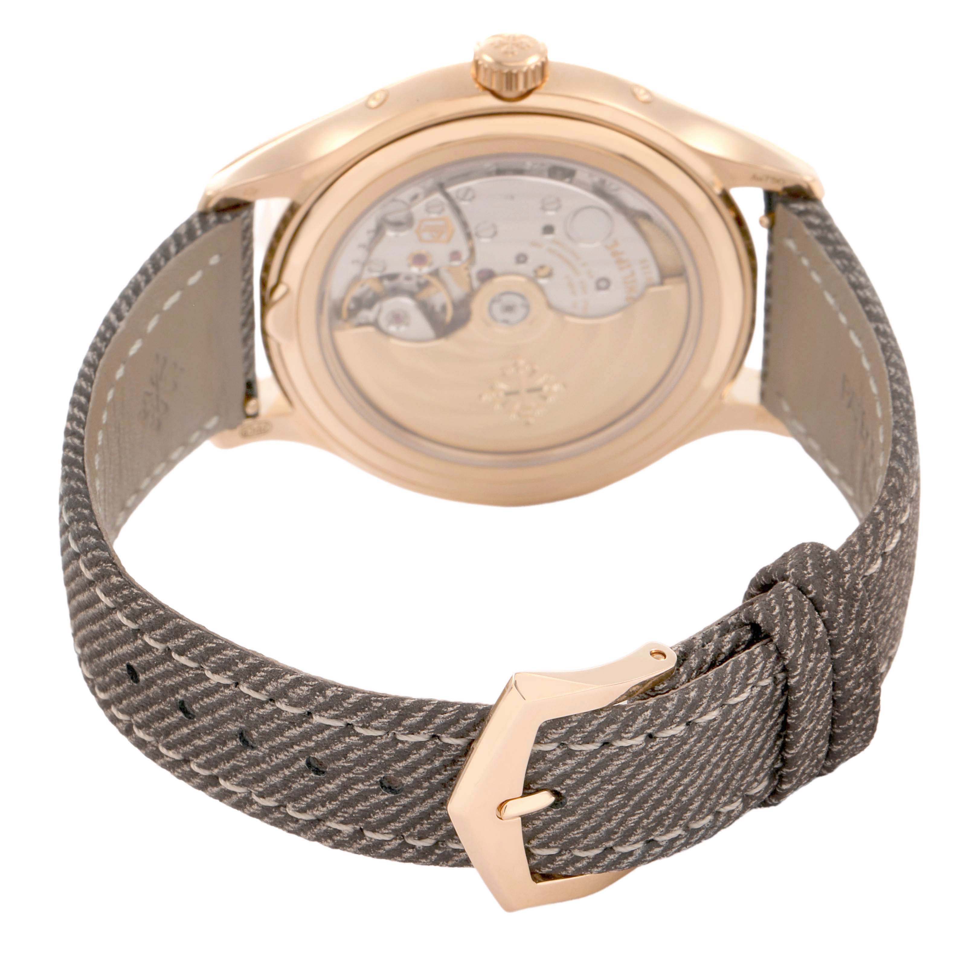 The image shows the back view of a Patek Philippe Complications 4946R-001 Men's Rose Gold Brown Dial watch, highlighting the movement and strap.