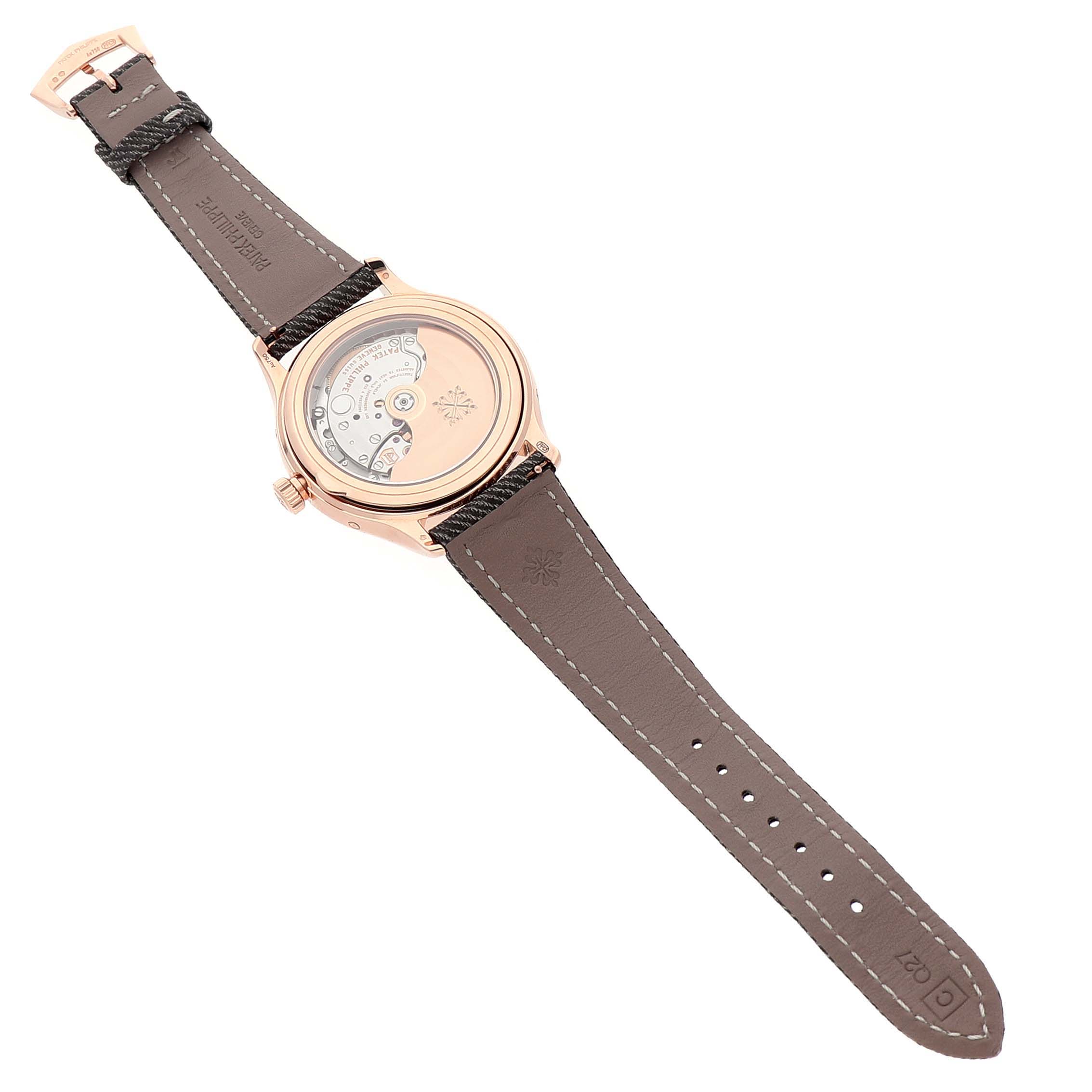 The image shows the back view of a Patek Philippe Complications 4946R-001 Men's Rose Gold Brown Dial watch, highlighting the transparent case back and movement mechanism.