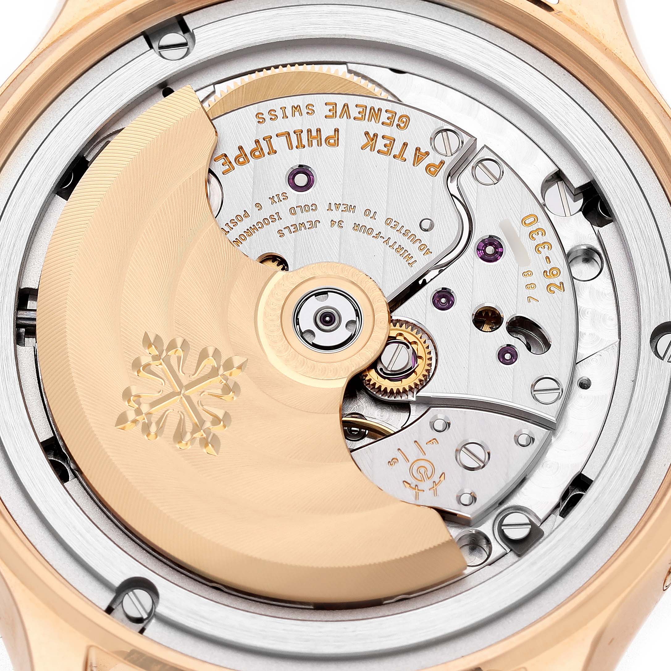 The image shows the back view of the Patek Philippe Complications 4946R-001 Men's Rose Gold Brown Dial watch, revealing the intricate movement and rotor.