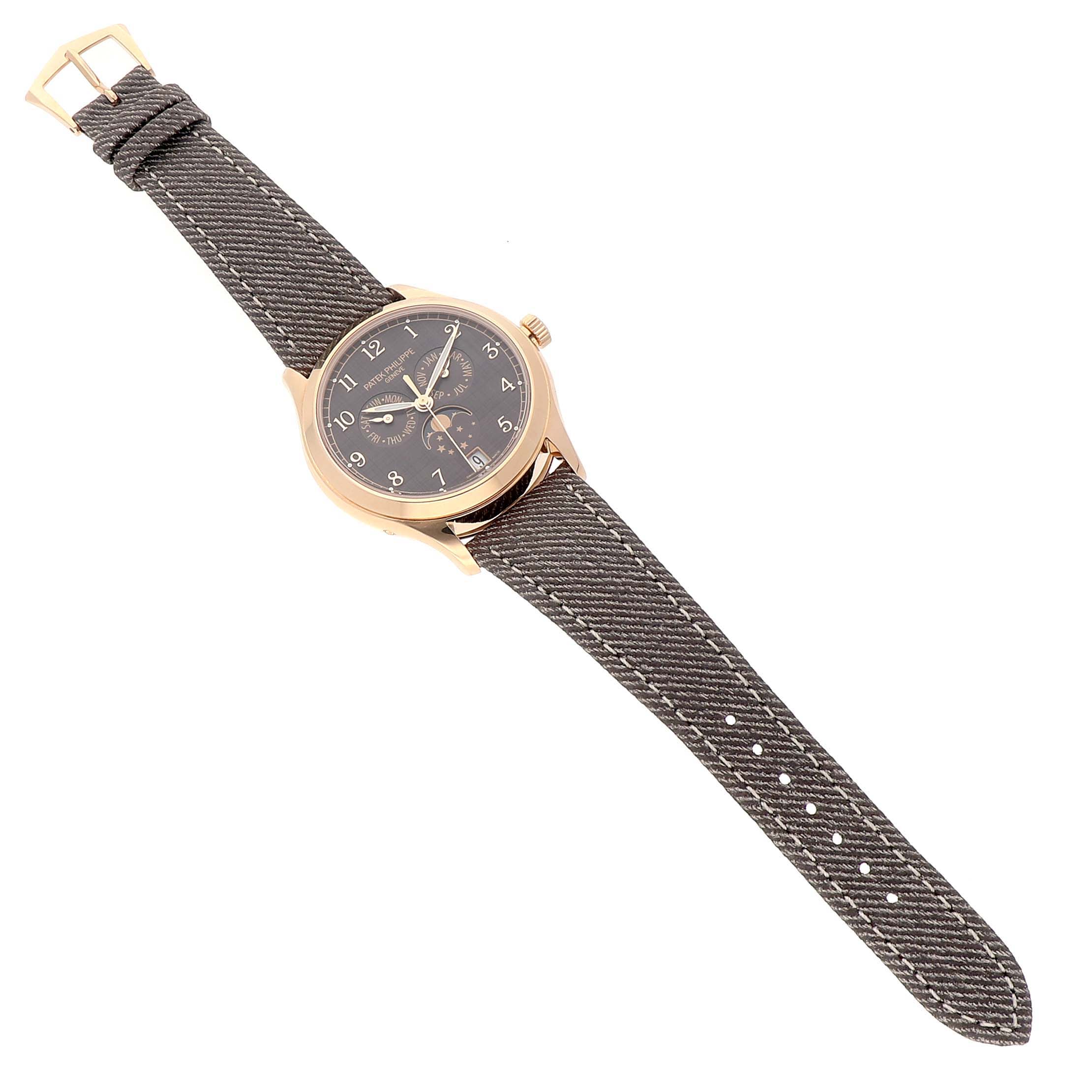 The Patek Philippe Complications 4946R-001 Men's Rose Gold Brown Dial watch is shown from a top view, displaying the face, strap, and buckle.