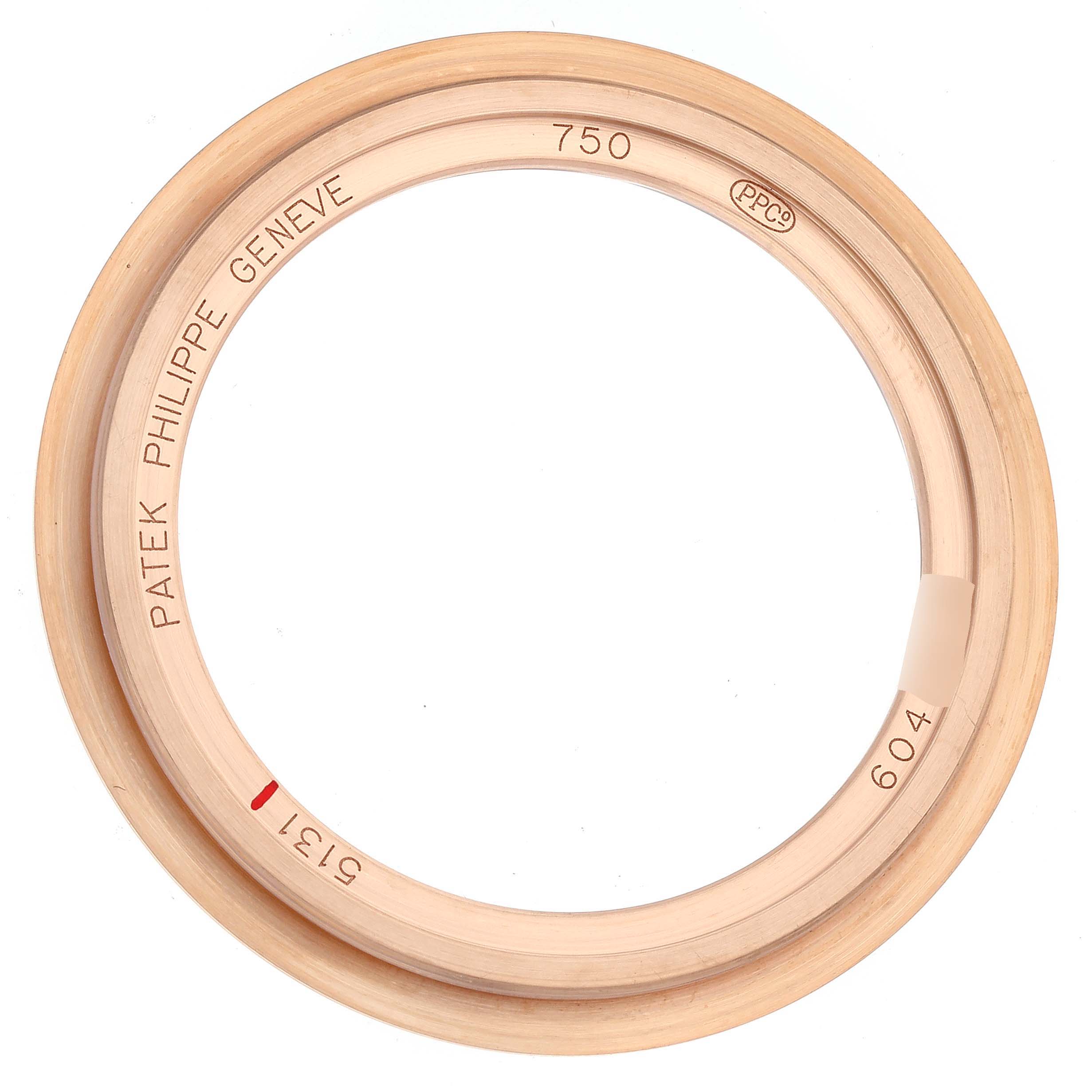 The image shows the round bezel of a Patek Philippe Complications 5131R Men's Rose Gold Silver Dial 5131R Men's Rose Gold Silver Dial watch, viewed from a top angle.