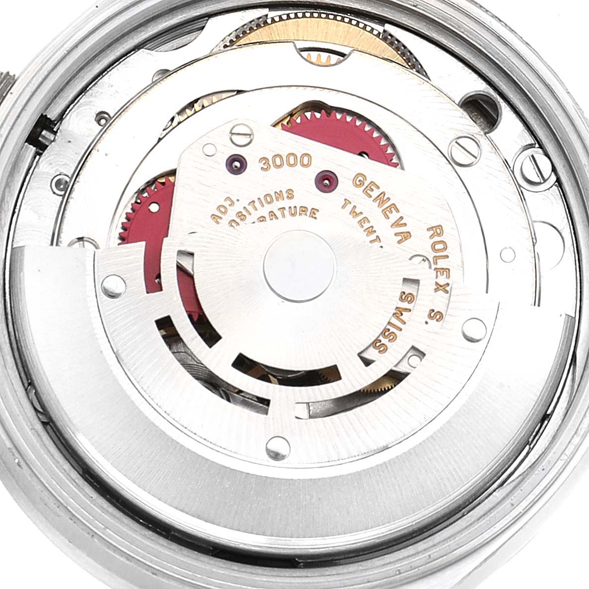 The image shows the intricate internal movement parts of a Rolex Air-King 14010 Men's Stainless Steel Blue Dial 14010 Men's Stainless Steel Blue Dial watch, viewed close-up, highlighting its gears and inscriptions.