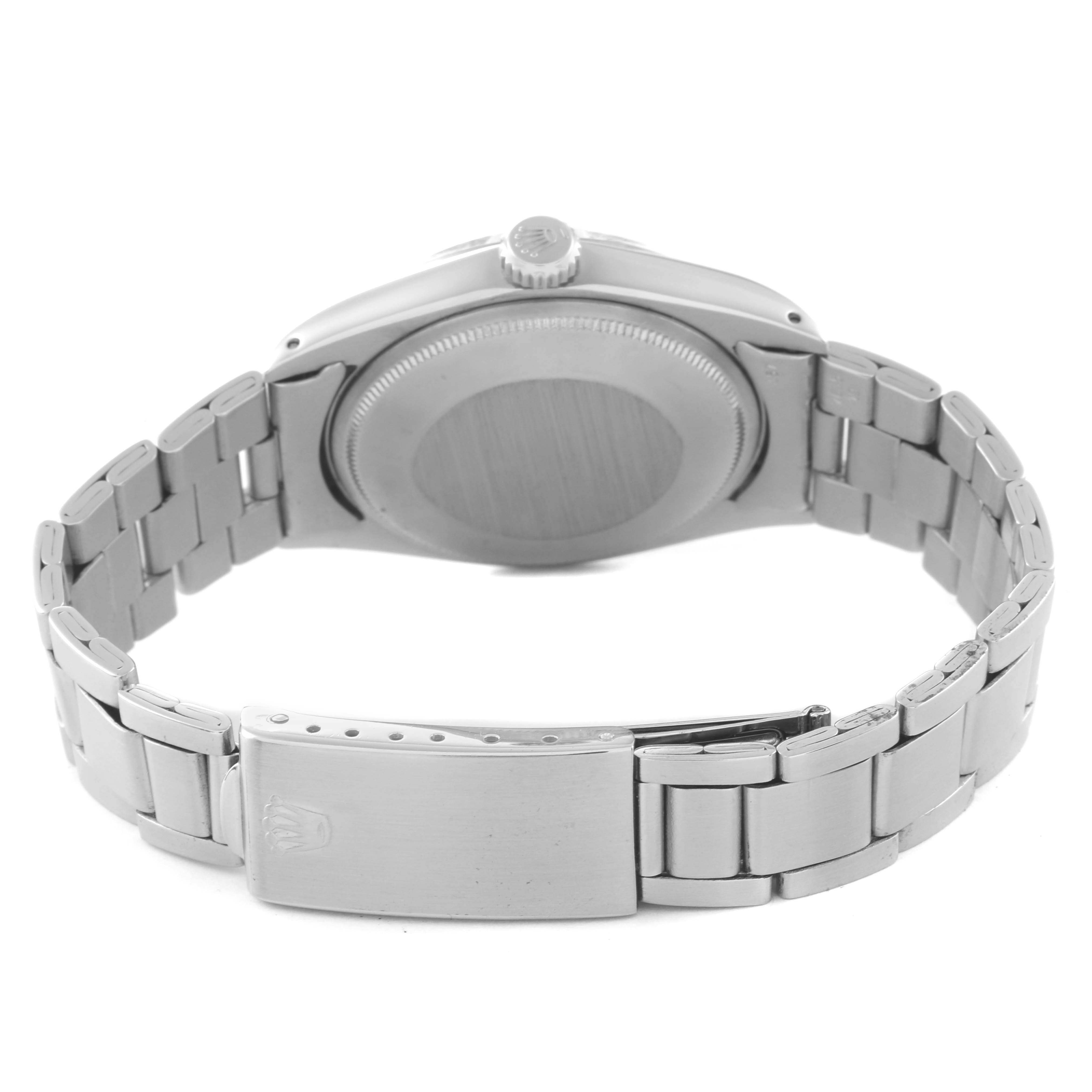 The Rolex Date 1500 Men's Stainless Steel Silver Dial model is shown from the back, highlighting the case back, bracelet, and clasp.