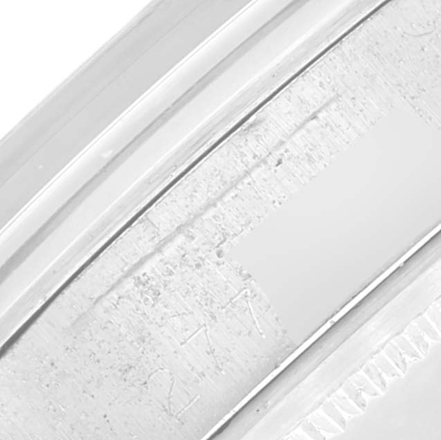 The image shows a close-up of the inner bezel with engravings of a Rolex Date 1500 Men's Stainless Steel Silver Dial model watch.