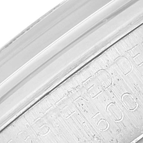 The image shows a close-up of the engraved inner bezel of a Rolex Date 1500 Men's Stainless Steel Silver Dial watch.