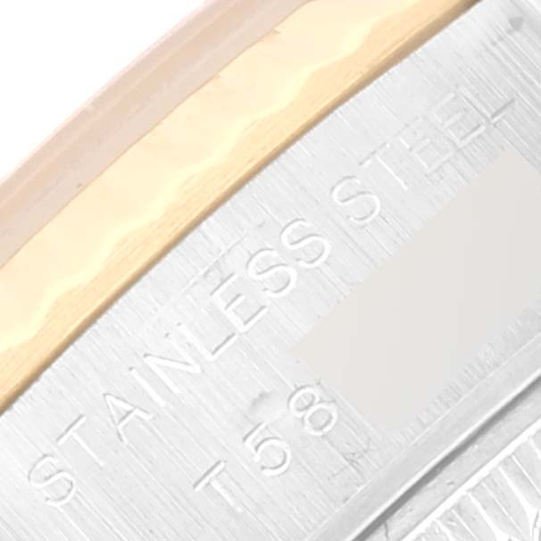 This is a close-up view of the Rolex Datejust 69173 Women's Steel and Gold (two tone) Black Dial 69173 Women's Steel and Gold (two tone) Black Dial watch, showing the edge with engraved "STAINLESS STEEL" text and part of the bezel.