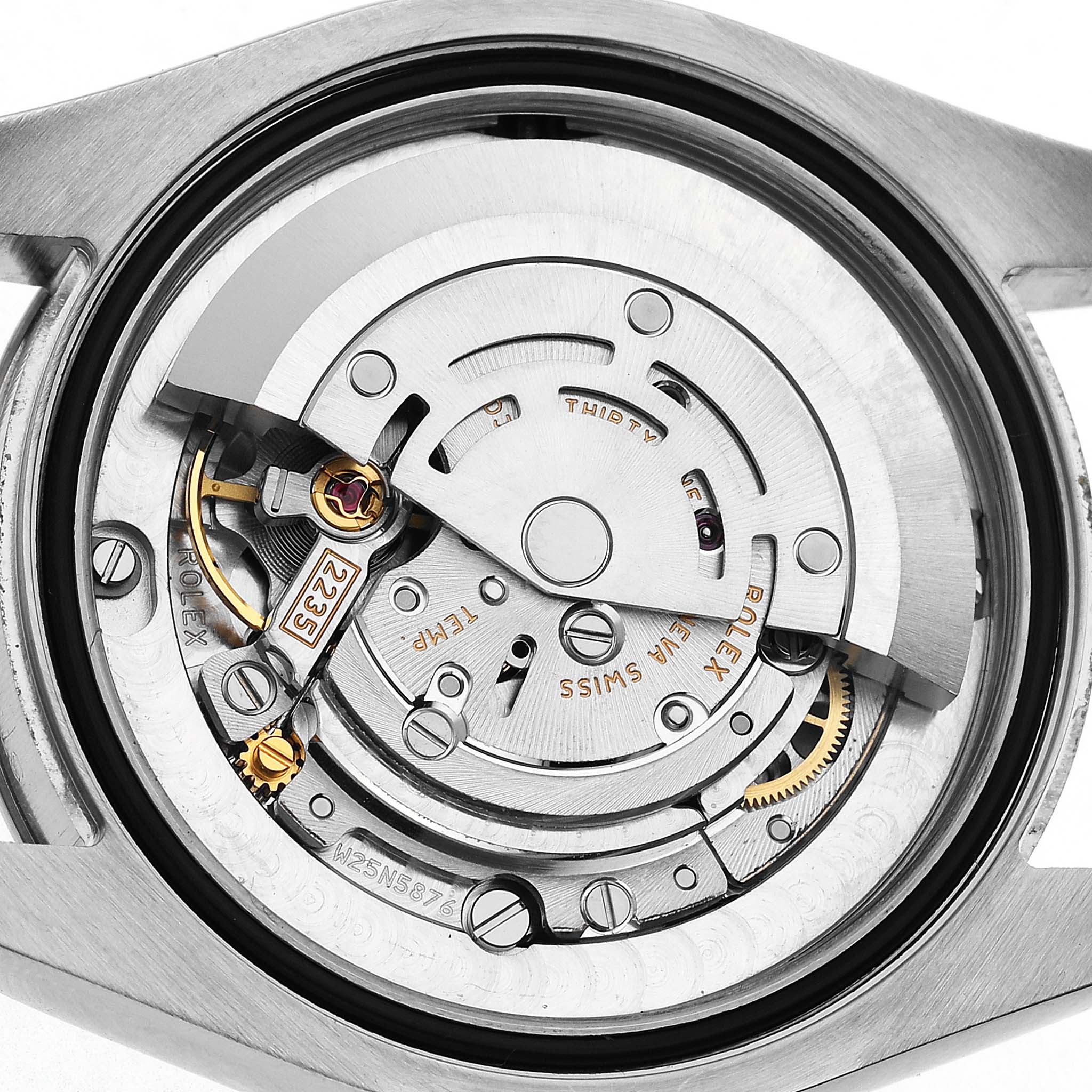 The Rolex Mid-Size 178274 Women's Stainless Steel Black Dial watch is shown from the back, revealing its internal movement and mechanical components.