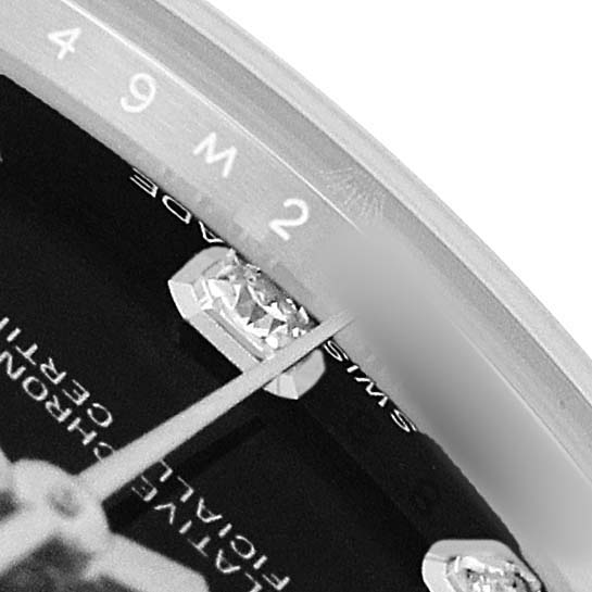 The image shows a close-up of the dial and diamond hour markers of a Rolex Mid-Size 178274 Women's Stainless Steel Black Dial watch, focusing on the bezel and hands.